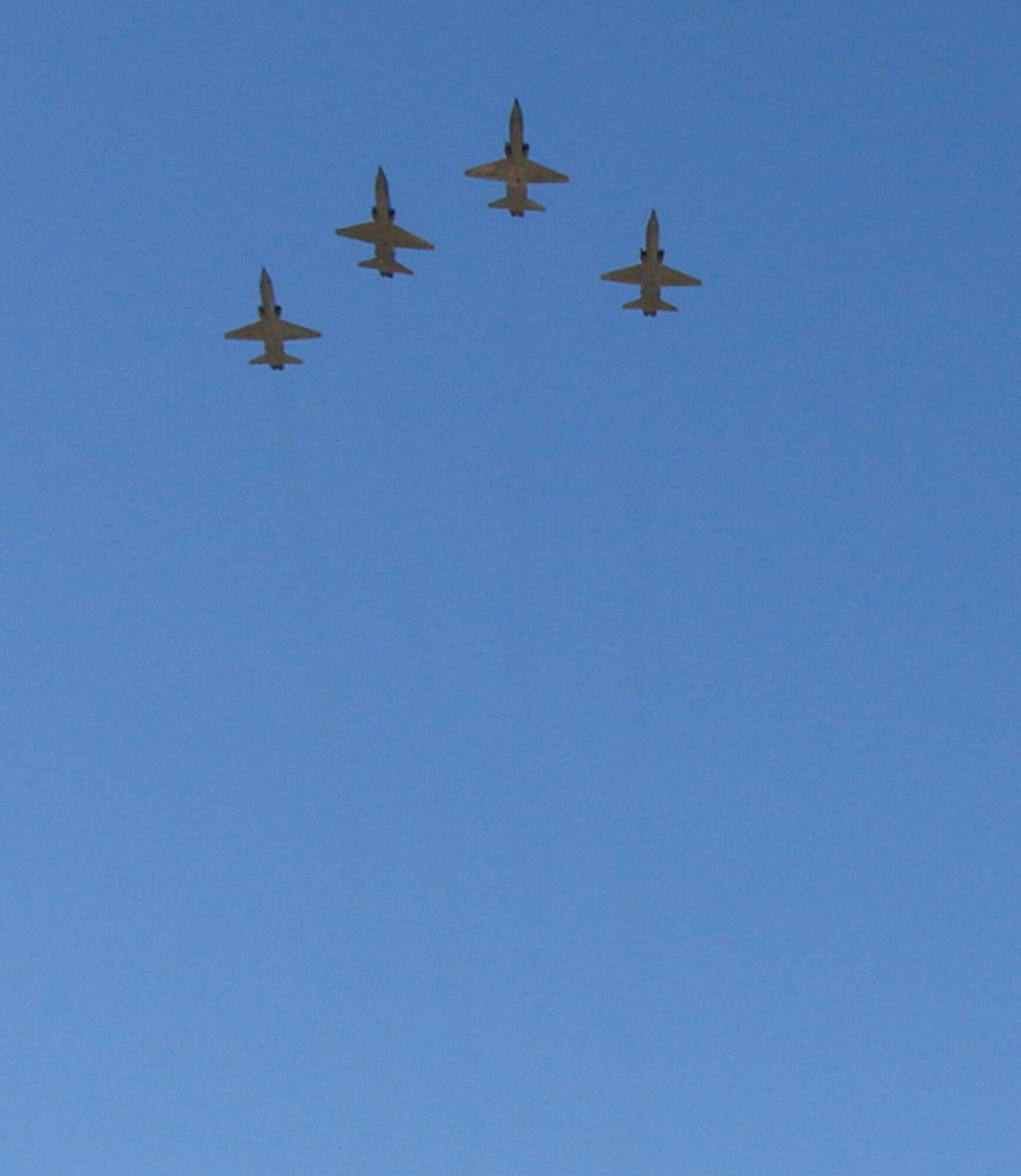 Four Vance Air Force Base T-38C Talon aircraft perform a flyover Nov. 16 to kickoff the Oklahoma Centennial parade in Guthrie, Okla. More than 75,000 people attended the celebratory event. (U.S. Air Force photo by Tech. Sgt. Mary Davis)