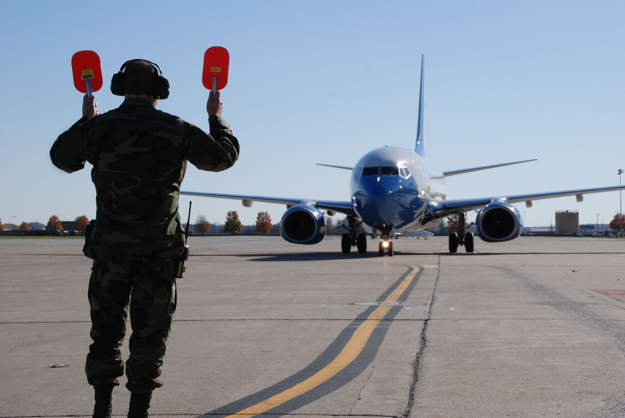 Senior Master Sgt. Bill Treakle of the maintenance squadron, 932nd Airlift Wing, directs the third C-40C to its parking spot right after it landed with Maj. Gen. Robert Duignan at the controls.  The Fourth Air Force commander flew the new plane from the factory to the Illinois Air Force Reserve unit on November 16, 2007.  Photo/Capt. Stan Paregien