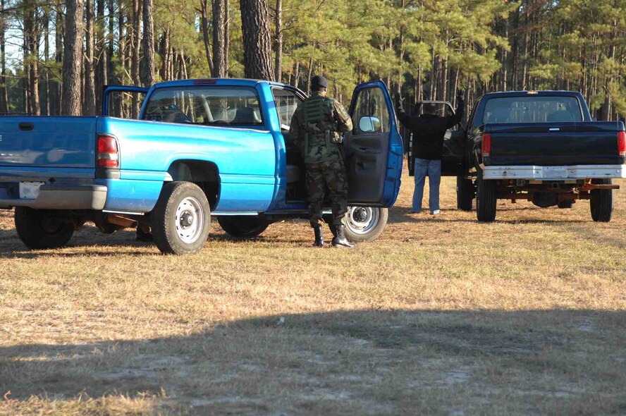 SHAW AIR FORCE BASE, S.C. -- Members of the 20th Security Forces Squadron apprehend a suspect as part of a Major Accident Response Exercise (MARE) on Nov. 16. The MARE tests the capability of Airmen to respond to an accident, disaster or catastrophe, such as a plane or car crash, explosion or attack. (U.S. Air Force photo/Staff Sgt. Henry L. Hoegen Jr.)