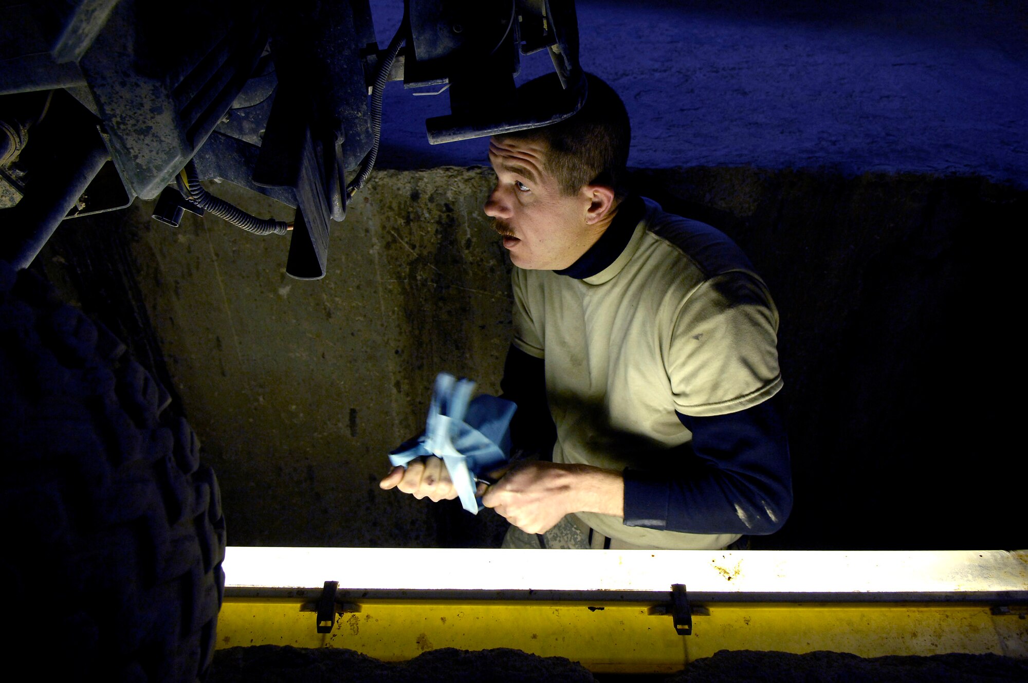Tech. Sgt. James Nelson performs preventative maintenance an all terrain vehicle Nov. 1 at forward operating base Lagman, Afghanistan. Sergeant Nelson is a vehicle maintenance technician filling a 365-day Army 'in-lieu-of' tasking. Sergeant Nelson is deployed here Nellis Air Force Base, Nev. (U.S. Air Force photo/Staff Sgt. Brian Ferguson)