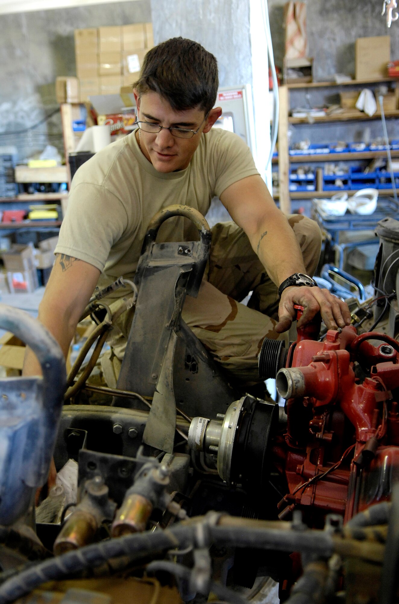 Tech. Sgt. Dave Albanese hooks up the lift pump on a Humvee Nov. 1 at forward operating base Lagman, in Afghanistan. Sergeant Albanese is a vehicle maintenance technician filling a 365-day Army 'in-lieu-of' tasking. Sergeant Albanese is deployed from Seymour Johnson Air Force Base, NC.  (U.S. Air Force photo/Staff Sgt. Brian Ferguson)