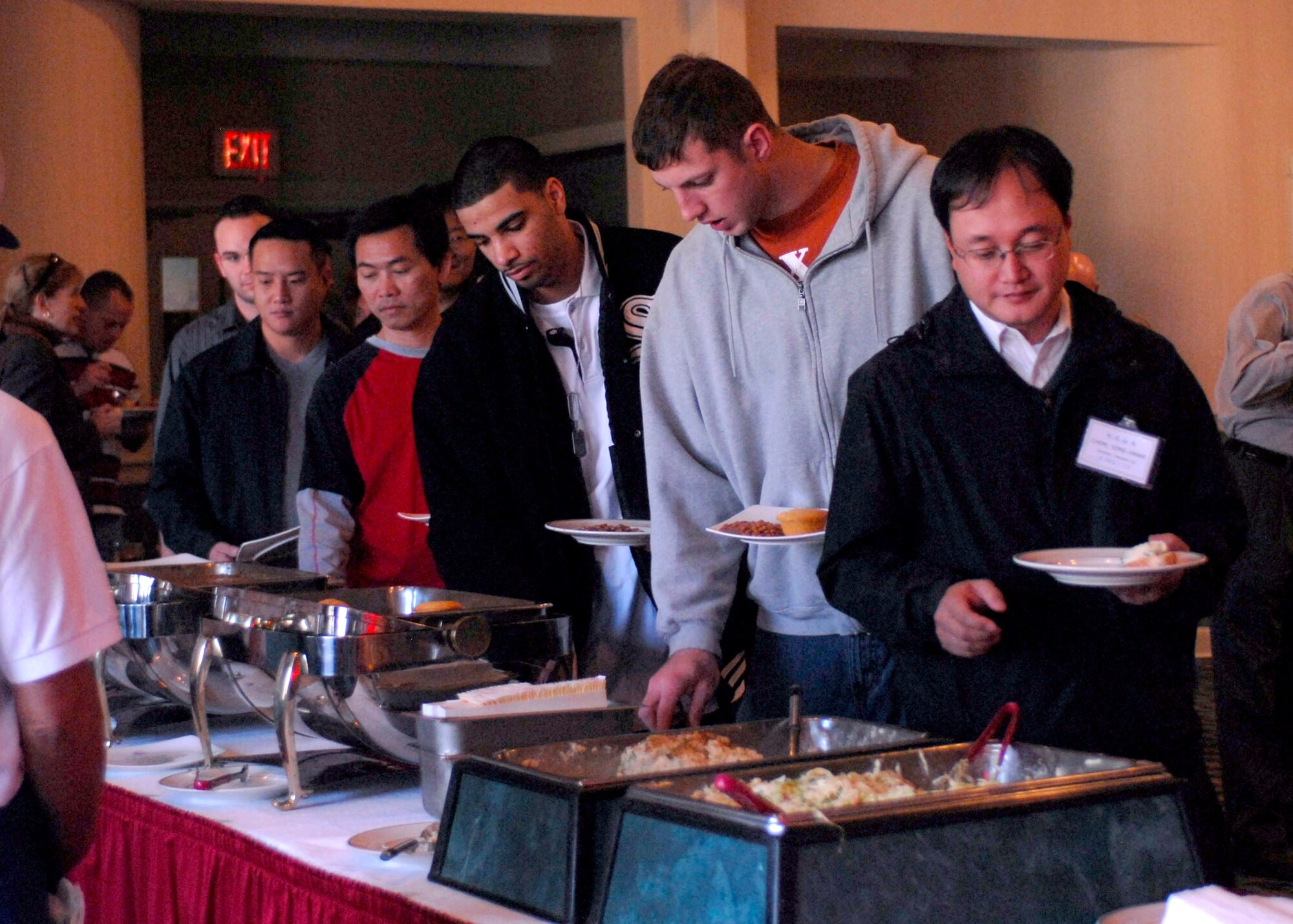Airmen from the 8th Fighter Wing enjoy a buffet provided by honorary commanders from Gunsan City, South Korea here Nov. 12. More than 60 honorary commanders held a friendship day for approximately 400 Wolf Pack Airmen to increase relationships between the base and local community. (U.S. Air Force photo/Staff Sgt. Araceli Alarcon)