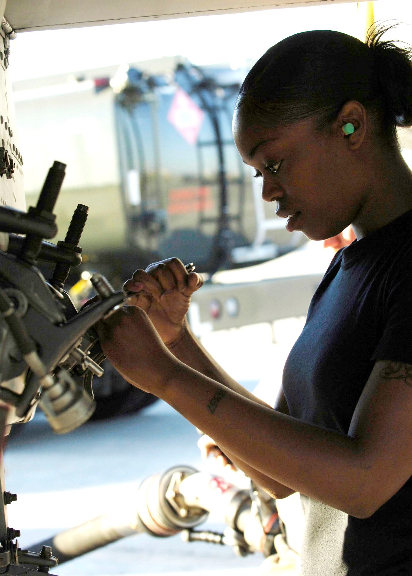 Senior Airman Ashley Hunter loads and secures a practice munition onto an A-10 Thunderbolt II Nov. 7 at MacDill Air Force Base, Fla. The bomblets are bound for the Avon Park Air Ground Training Complex as part of Exercise Atlantic Strike VI. The exercise is a U.S. Central Command Air Forces-sponsored exercise aimed at improving the coordination between joint terminal attack controllers and aircraft during urban close-air-support scenarios. Airman Hunter is a weapons load crew member from Spangdahlem Air Base, Germany. (U.S. Air Force photo/Airman 1st Class Stephenie Wade) 
