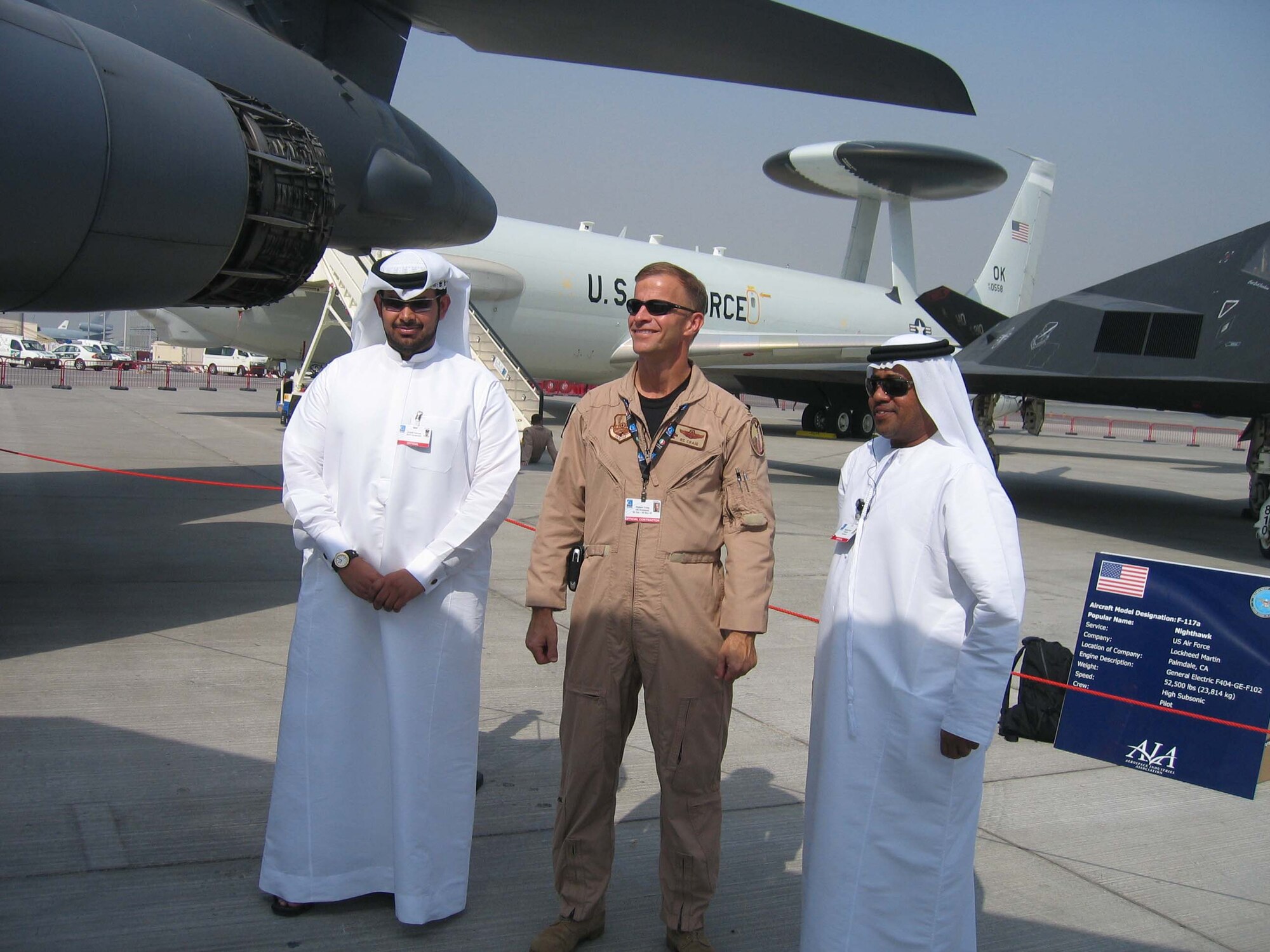 Colonel Robert Craig, director of exercises and engagements, U.S. Central Command Air Forces, an on-scene commander for the U.S. military contingent talks with two Dubai police officers. The police officers are part of the team responsible for security at the Dubai Air Show and will ensure the security of U.S. aircraft upon departure from Dubai. More than 250 Airman, Soldiers and Sailors and various Air Force and Navy aircraft from bases in the Persian Gulf region and  the United States are supporting the air show from Nov 11-15.  The United States military is a long-standing participant in the biennial Dubai Air Show.  (Air Force Photo by Chief Master Sgt. Renee Tyron)