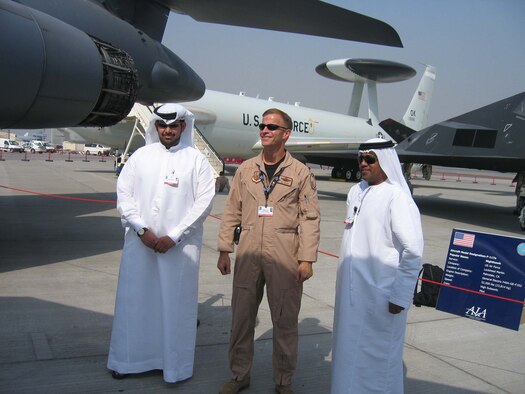 Colonel Robert Craig, director of exercises and engagements, U.S. Central Command Air Forces, an on-scene commander for the U.S. military contingent talks with two Dubai police officers. The police officers are part of the team responsible for security at the Dubai Air Show and will ensure the security of U.S. aircraft upon departure from Dubai. More than 250 Airman, Soldiers and Sailors and various Air Force and Navy aircraft from bases in the Persian Gulf region and  the United States are supporting the air show from Nov 11-15.  The United States military is a long-standing participant in the biennial Dubai Air Show.  (Air Force Photo by Chief Master Sgt. Renee Tyron)