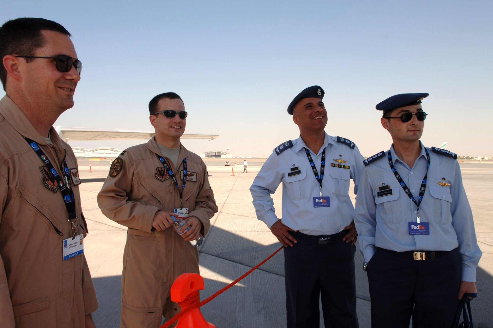 1st Lt. Jeffery Dallas and Capt. John Dress speak with members of the Royal Jordanian Air Force Nov. 11 during the Dubai Air Show. Lieutenant Dallas and Captain Dress are E-3 Sentry AWACS aircrew members with the 552 Air Control Wing from Tinker Air Force Base, Okla. The United States military provided support for the 10th annual Dubai Air Show Nov. 11 to 15. Approximately 300 Airman, Soldiers and Sailors, and various Air Force and Navy aircraft from bases in the Persian Gulf region and the United States exhibit a snapshot of the U. S. military's diverse aircraft inventory. The air show was an opportunity to build relationships with allied partners. (U.S. Air Force photo/Tech. Sgt. Charlein C. Sheets)