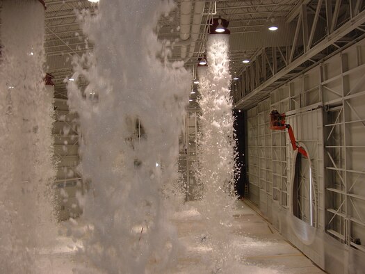 WRIGHT-PATTERSON AFB, Ohio -  A final fire suppression foam test is conducted in the 445th Airlift Wing's new Fuel System Maintenance Hangar Nov. 15, 2007 before the hangar is turned over to the wing.  The Fuels hangar will be the first hangar completed since the 445th aquired the C-5 Galaxy aircraft.  The $65 million construction project accomodates the wing's ten C-5s and includes two new tail-in hangars, the fuels hangar, a new squadron operations building, and other renovations. (U.S. Air Force photo/Master Sgt. Randel Cunigan) 