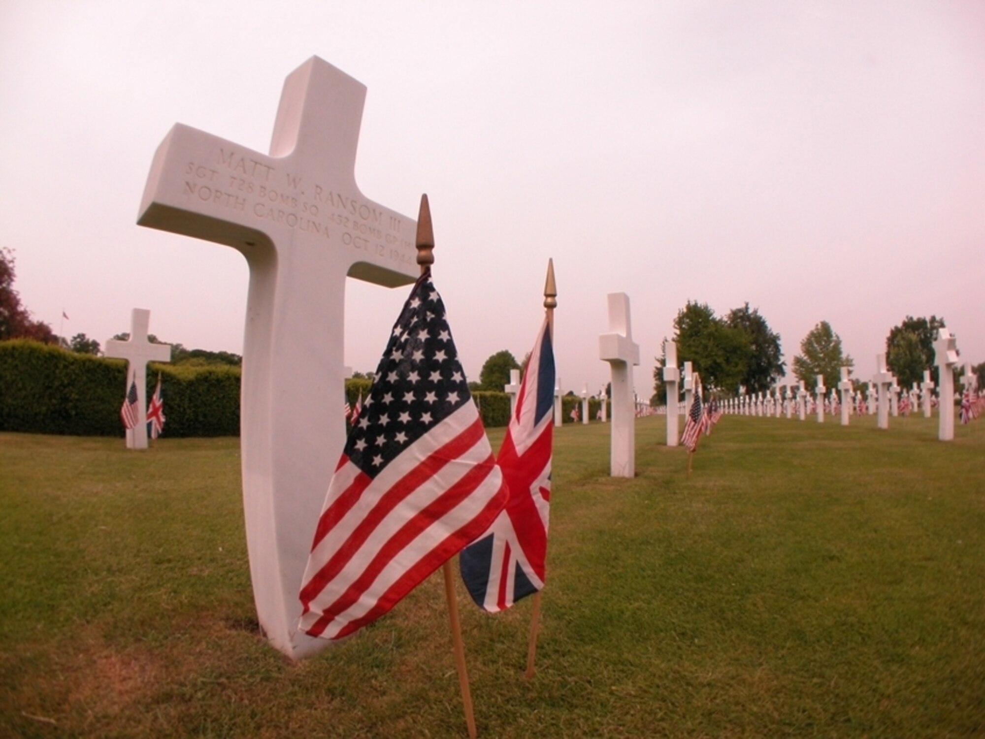 A headstone at the Cambridge American Military Cemetery marks the burial place of Tech Sgt. Matt Ransom III, one of seven 452nd Bombardment Group members who died in the Oct. 12, 1944, crash of the B-17 Inside Curve. (U.S. Air Force photo by Senior Master Sgt. Matt Proietti)