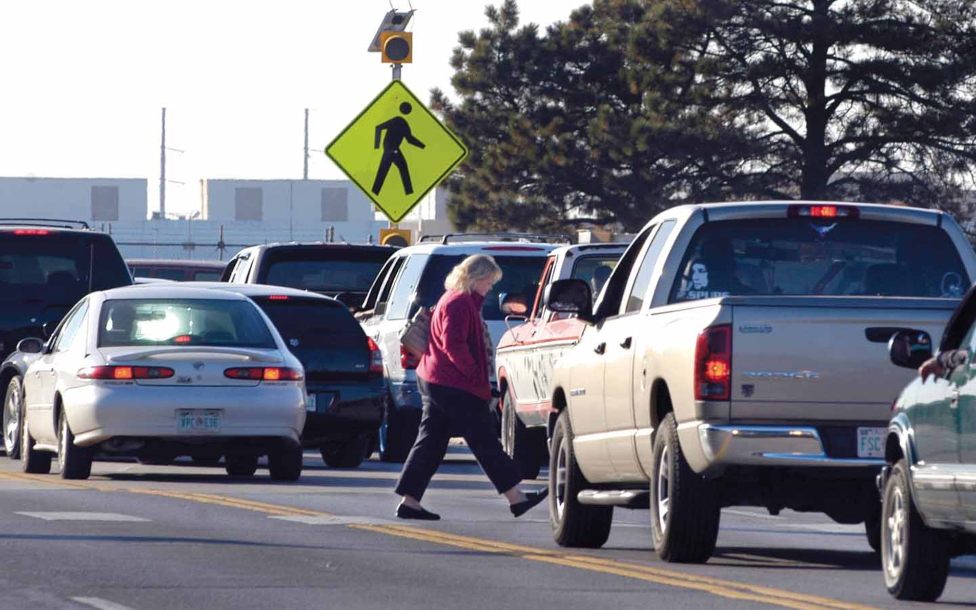 Pedestrians have the right-of-way when crossing roads in designated crosswalks, but those crossing need to be sure drivers see them before stepping into the street. (Air Force photo by Margo Wright)