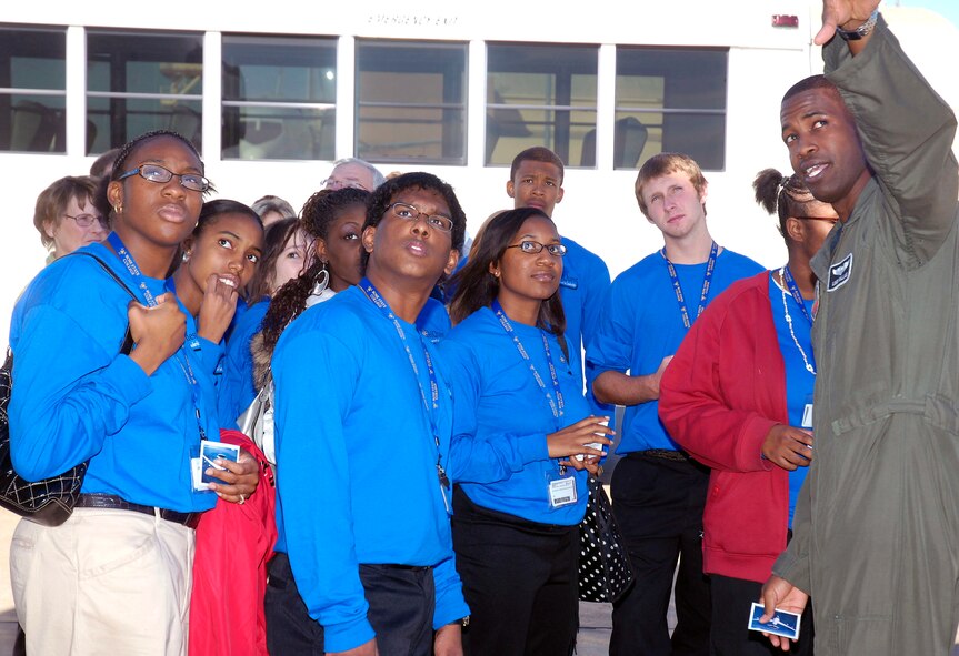 Capt. Lonzo E. Wallace, 960th Airborne Air Control Squadron, points out aspects of the E-3 Sentry to several outstanding DelQuest students during their visit to Tinker Air Force Base Nov. 8. (Air Force photo by Dave Faytinger)