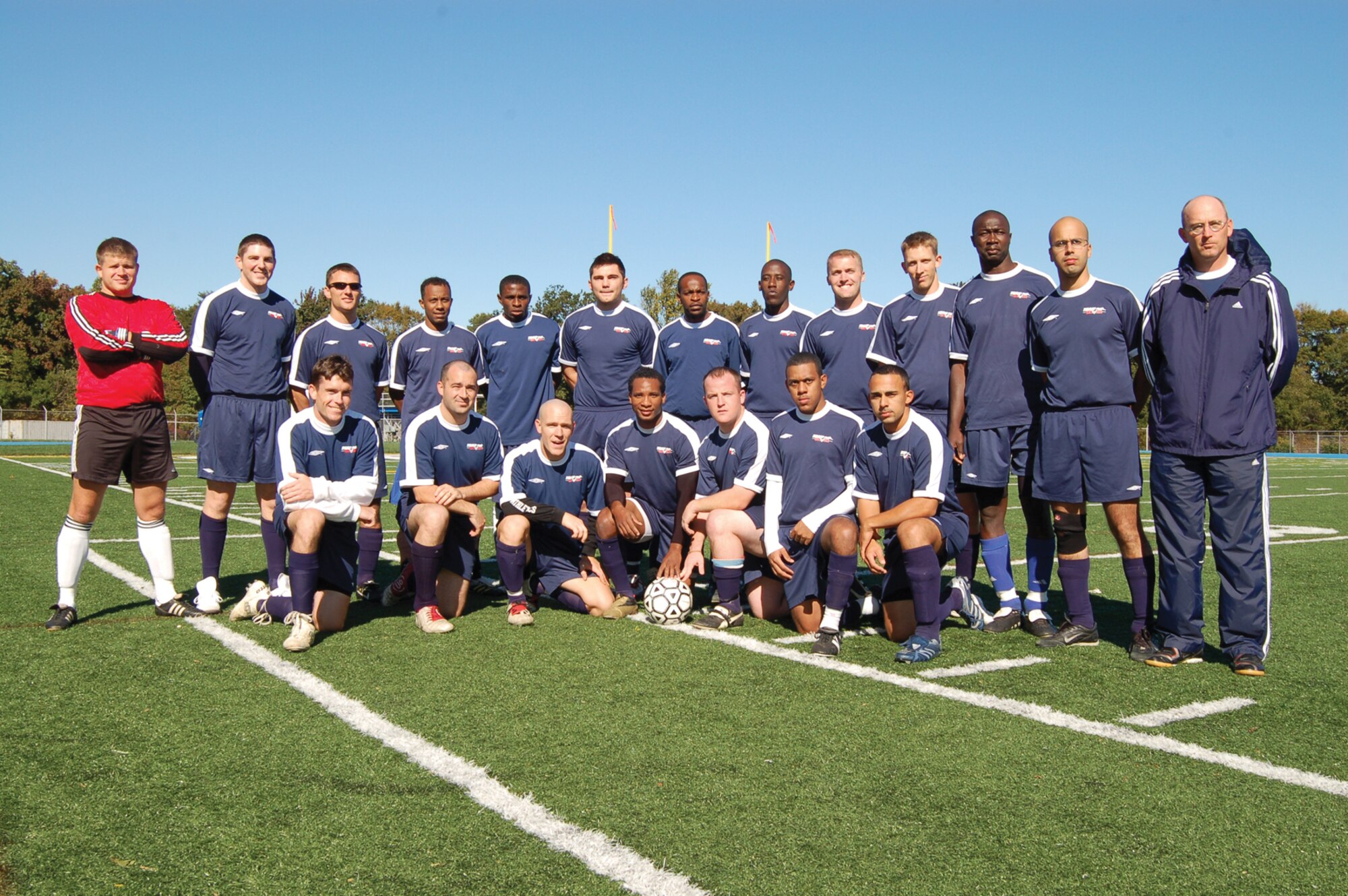 DOVER AIR FORCE BASE, Del. -- Team Dover stands on the turf at Dover High School Oct. 28 where they played against the Derbotibo Beracruz with a resulting score of 2 - 1 in the Liga de futbol de clubs asociados de Delaware (LIFUCAD) soccer championship game. Though Team Dover did not win the title, their overall 55 points for the season provided an impressive 13 wins, three draws and only two losses. "We're extremely motivated to win because we were kind of the laughing-stock last year since the other teams didn't think we belonged in their league," said Bryan 'Skip' Ford, (pictured right) Team Dover coach and a senior master sergeant with the 512th Maintenance Group. "But, this year, we've earned our way up to the top and won a lot of respect from the community." (U.S. Air Force photo/Senior Airman James Bolinger)

