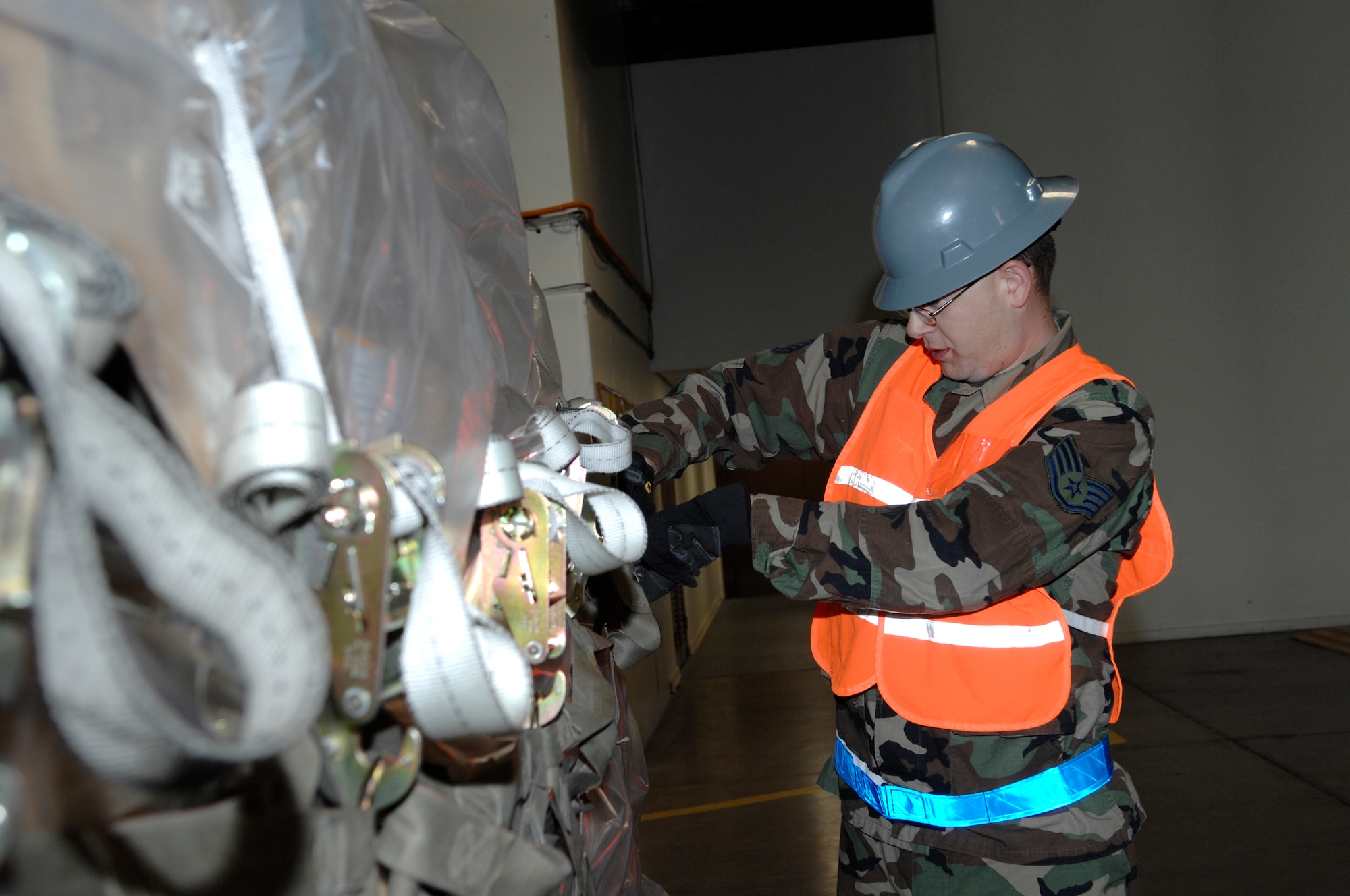 Staff Sgt. Wesley Lindsey, 28th Civil Engineer Squadron, checks cargo in the cargo deployment function during an Operational Readiness Inspection at Ellsworth Air Force Base, S.D., Nov. 15, 2007. The cargo deployment function is responsible for ensuring all cargo is properly documented and secured for transportation. (U.S. Air Force photo/Senior Airman Angela Ruiz)


