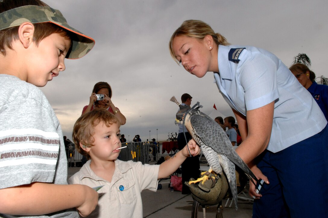 Air Force Academy Cadet 2nd Class Kimberly Robinson introduces Oblio to participants of a Make-a-Wish Foundation event Nov. 9 during the Aviation Nation air show at Nellis Air Force Base, Nev.  (U.S. Air Force photo/Senior Airman Larry E. Reid Jr.)