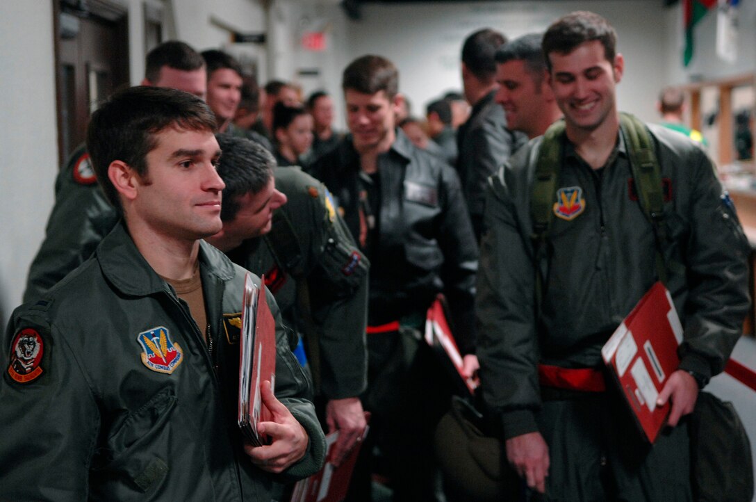 Airmen from the 28th Bomb Wing process through a simulated deployment line during Operational Readiness Inspection (ORI) Coronet White 07-ACC-12 at Ellsworth Air Force Base, S.D., Nov. 15, 2007.  An Air Combat Command inspection team will use this ORI to evaluate Ellsworth's ability to effectively and rapidly deploy.  (U.S. Air Force photo by SSgt Michael B. Keller)(Released)