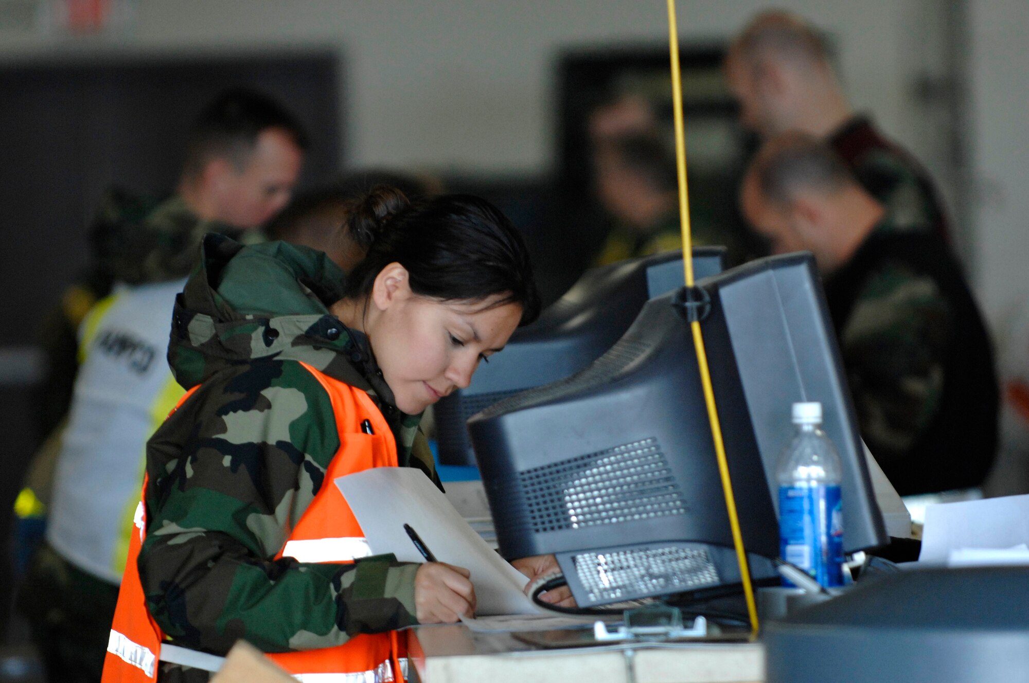 U.S. Air Force Airman 1st Class Erendira Schoreder, from the 28th Logistics Readiness Squadron, reviews packing lists while processing cargo during Operational Readiness Inspection (ORI) Coronet White 07-ACC-12 at Ellsworth Air Force Base, S.D., Nov. 15, 2007.  An Air Combat Command inspection team will use this ORI to evaluate the 28th Bomb Wing's ability to effectively and rapidly deploy.  (U.S. Air Force photo by SSgt Michael B. Keller)(Released)
