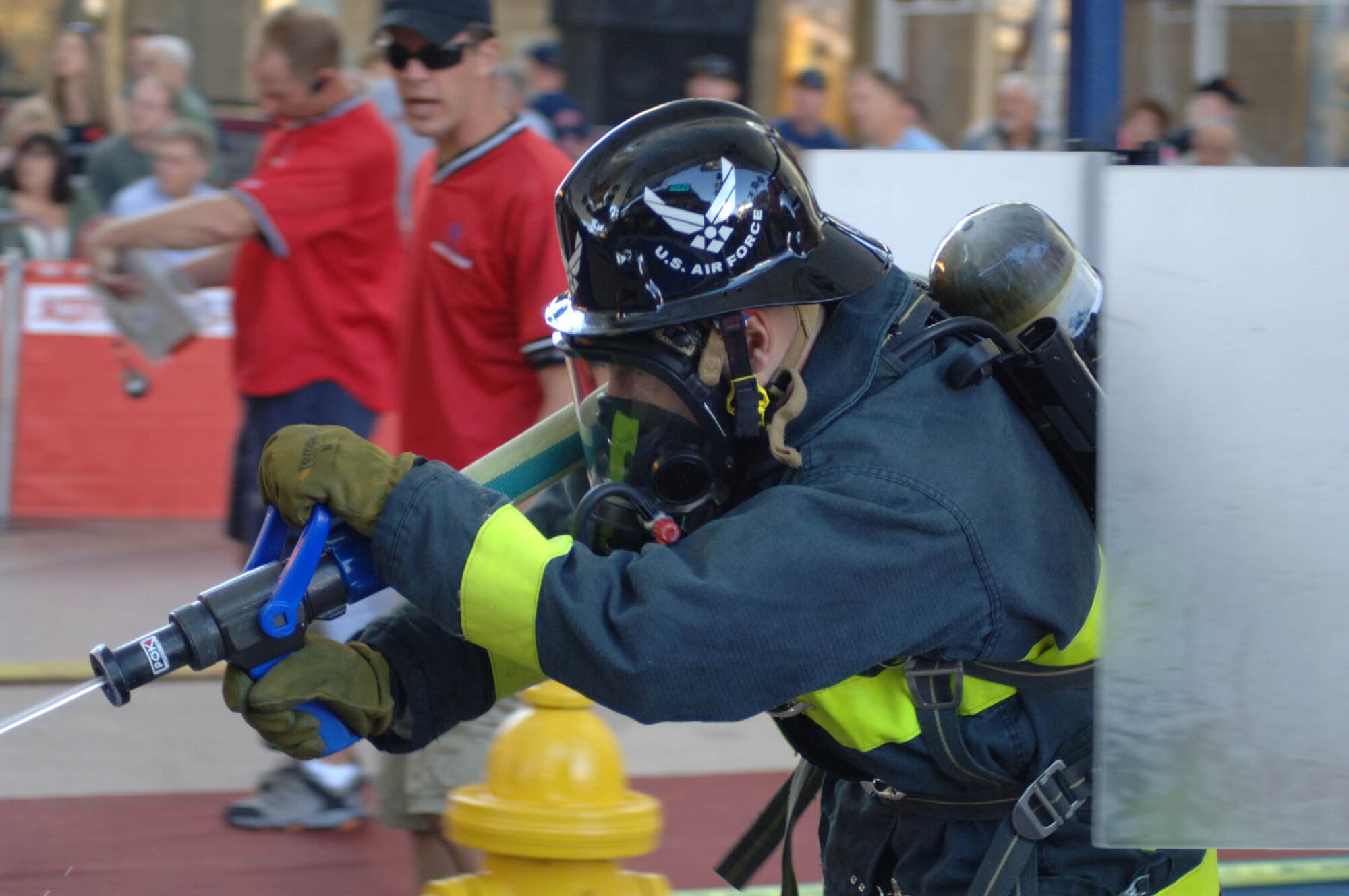 LAS VEGAS (AFPN) – Spangdahlem AB firefighter Gerd Mueller, 52nd Civil Engineer Squadron, demonstrates his accuracy with a firehose, by hitting a volleyball-sized target with a stream of water, during the World Firefighter Combat Challenge XVI Nov. 6 in downtown Las Vegas. (U.S. Air Force photo/John Van Winkle)