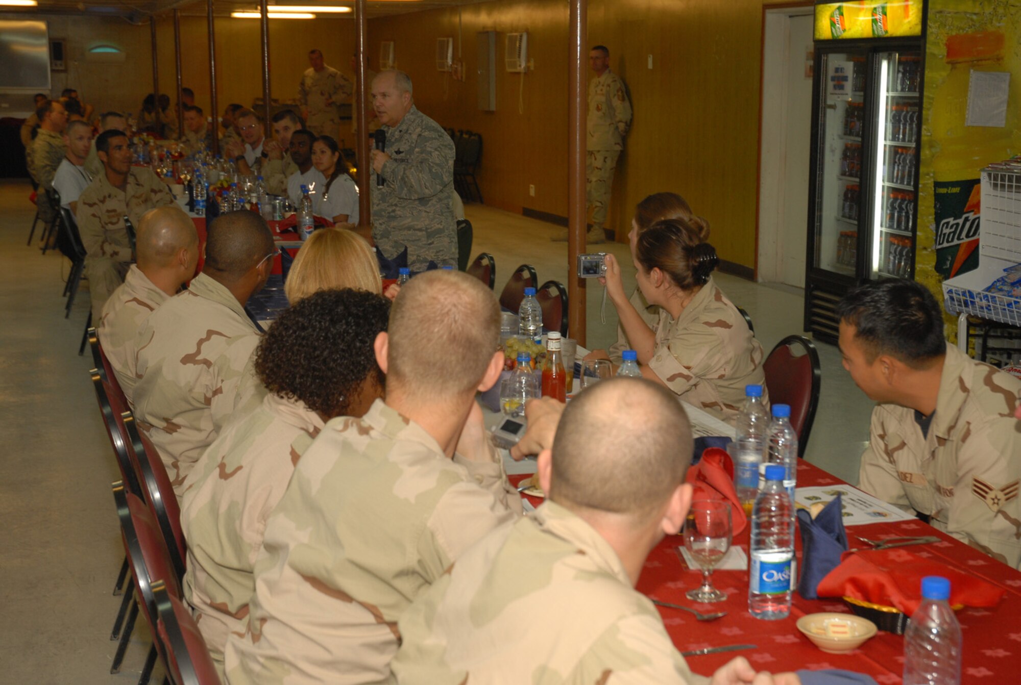 SOUTHWEST ASIA - Brig. Gen. Charles Lyon, 379th Air Expeditionary Wing commander, delivers a birthday greetings message Nov. 13 to all servicemembers celebrating birthdays in the month of November at an air base in Southwest Asia. The birthday dinner is a monthly event hosted by senior noncommissioned officers and officers for all servicemembers celebrating birthdays in that particular month. (U.S. Air Force photo/Staff Sgt. Douglas Olsen)