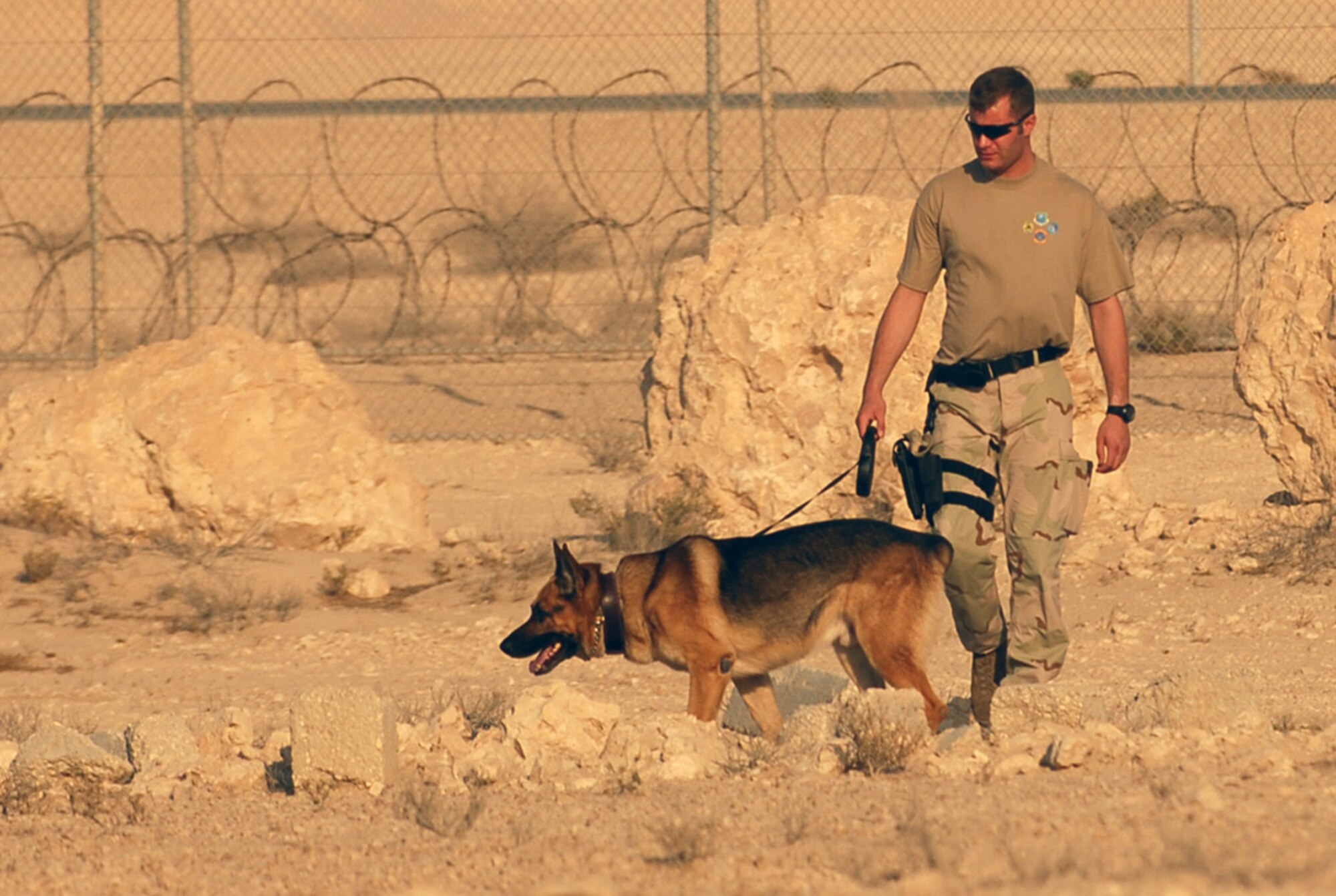 SOUTHWEST ASIA - Staff Sgt. Andrew Goligowski and his K9 partner, Endy, work a training course Nov. 14 at a Southwest Asia air base. Sergeant Goligowski is deployed from Grand Forks Air Force Base, ND. His partner, Endy, is seven years old.  (U.S. Air Force photo/Staff Sgt. Douglas Olsen)