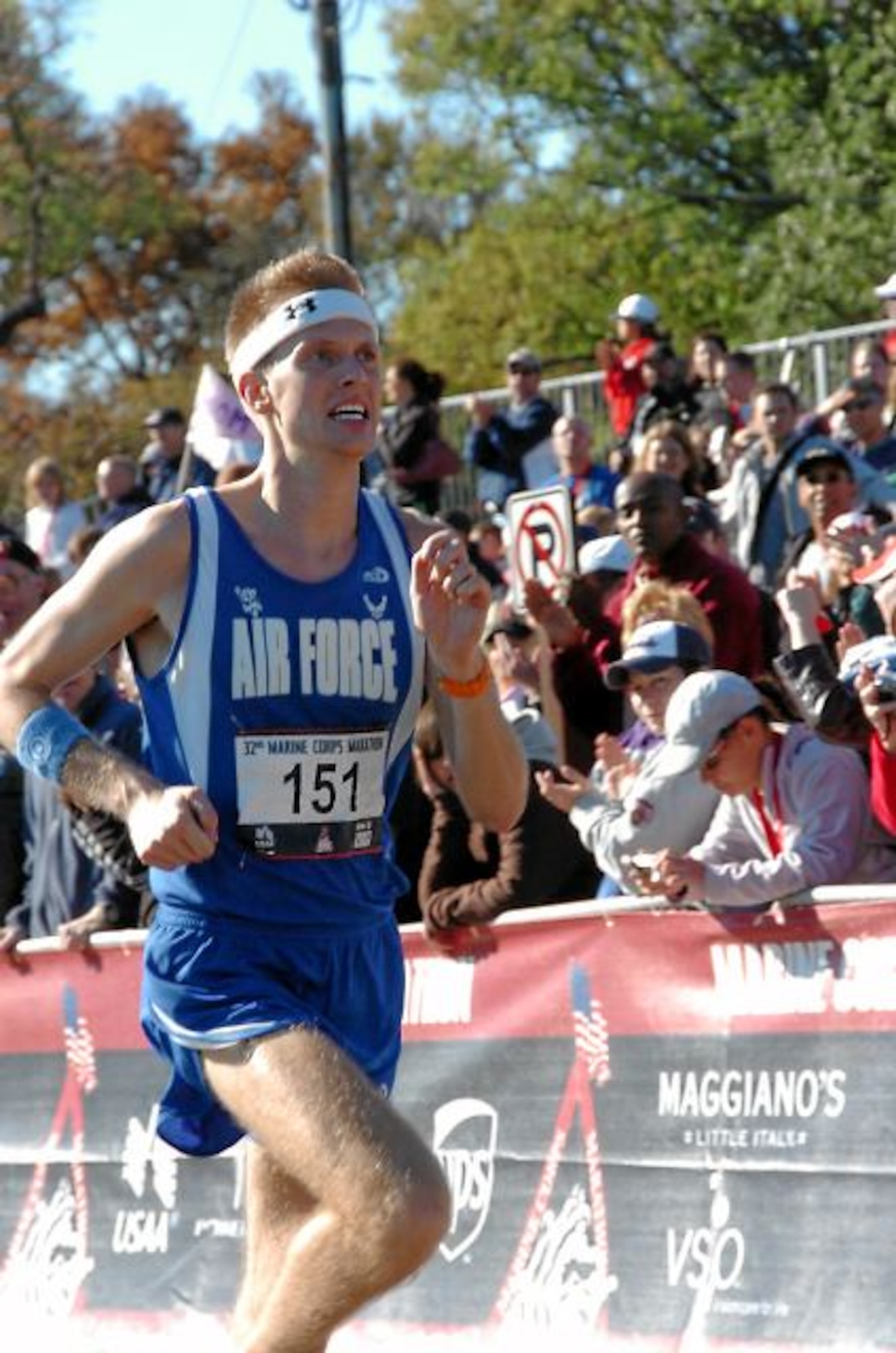WASHINGTON --  Brian Dumm runs to the cheers of the crowd at the Marine Corps Marathon on Oct. 28. Dumm, a lieutenant with the 7th Air Force at Osan Air Base, placed sixth overall and first for military runners at 2:28:27. (Photo courtesy of Marine Corps Marathon)