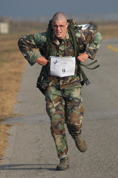 KUNSAN AIR BASE, South Korea--  Airman James Butler from the 8th Security Forces Squadron, approaches a water checkpoint during the 1st Annual Veterans Day Memorial Ruck/Run held here Nov. 17.  Ten teams comprised of four members participated in a 10K march carrying 40 pound ruck sacks followed by a 1.5 mile run. 
Teams from the Republic of Korea Air Force joined U.S. teams from Kunsan and Osan Air Bases for the competition in an effort to build teamwork and camaraderie.  (U.S. Air Force Photo/Master Sgt. Jack Braden)
