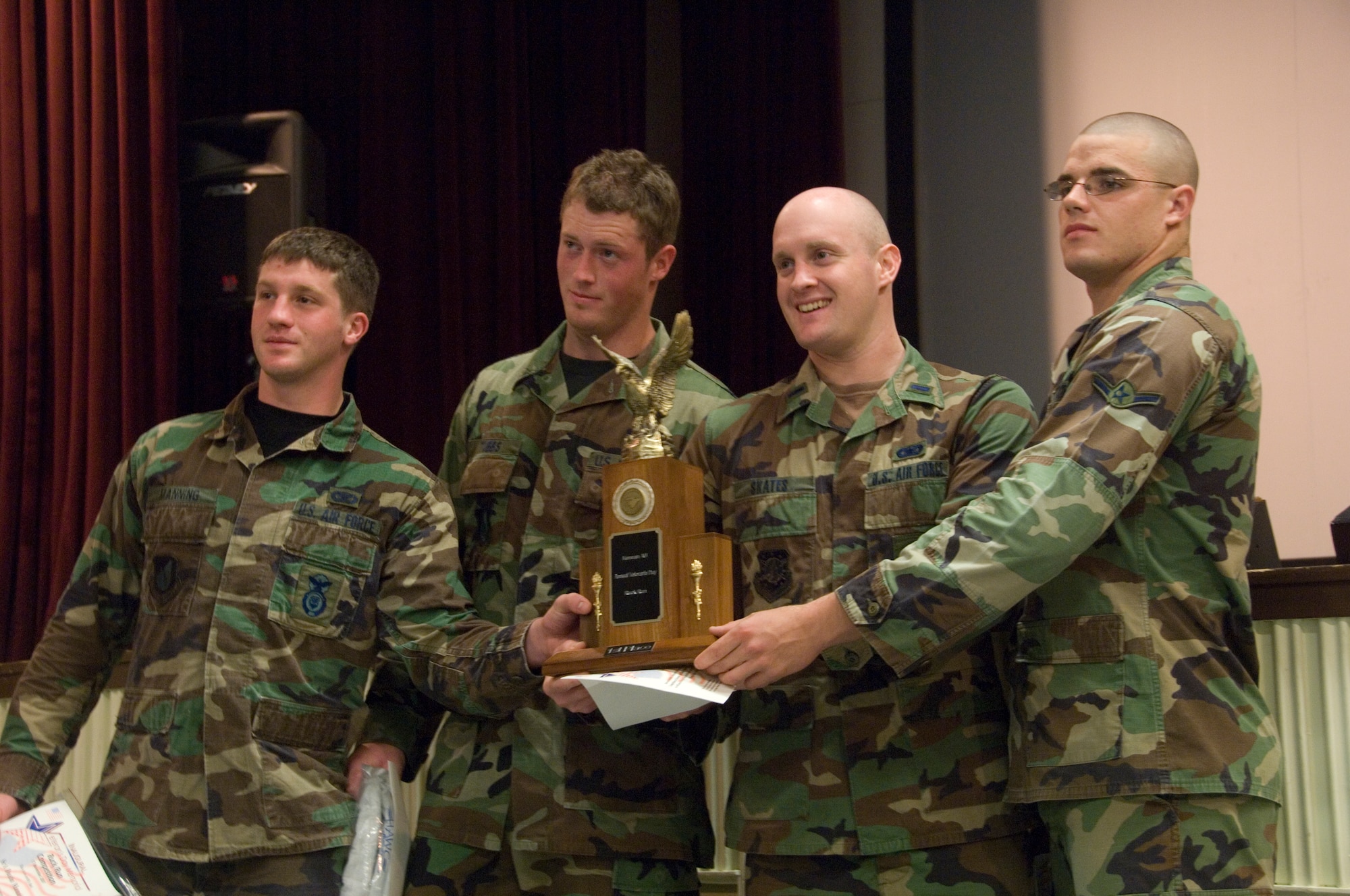 KUNSAN AIR BASE, South Korea--  Members of the 8th Security Forces Squadron "Bulldog Flight," hold up the first place trophy after winning the 1st Annual Veterans Day Memorial Ruck/Run held here Nov. 17.  Ten teams comprised of four members participated in a 10K march carrying 40 pound ruck sacks followed by a 1.5 mile run. “Bulldog Flight” finished in first place with an overall team time of 1:33:16.  Team members from left to right are Senior Airman Dustin Manning, Senior Airman Brad Tubbs, 1st Lt. Brett Skates, and Airman James Butler.
Teams from the Republic of Korea Air Force joined U.S. teams from Kunsan and Osan Air Bases for the competition in an effort to build teamwork and camaraderie.  (U.S. Air Force Photo/Master Sgt. Jack Braden)
