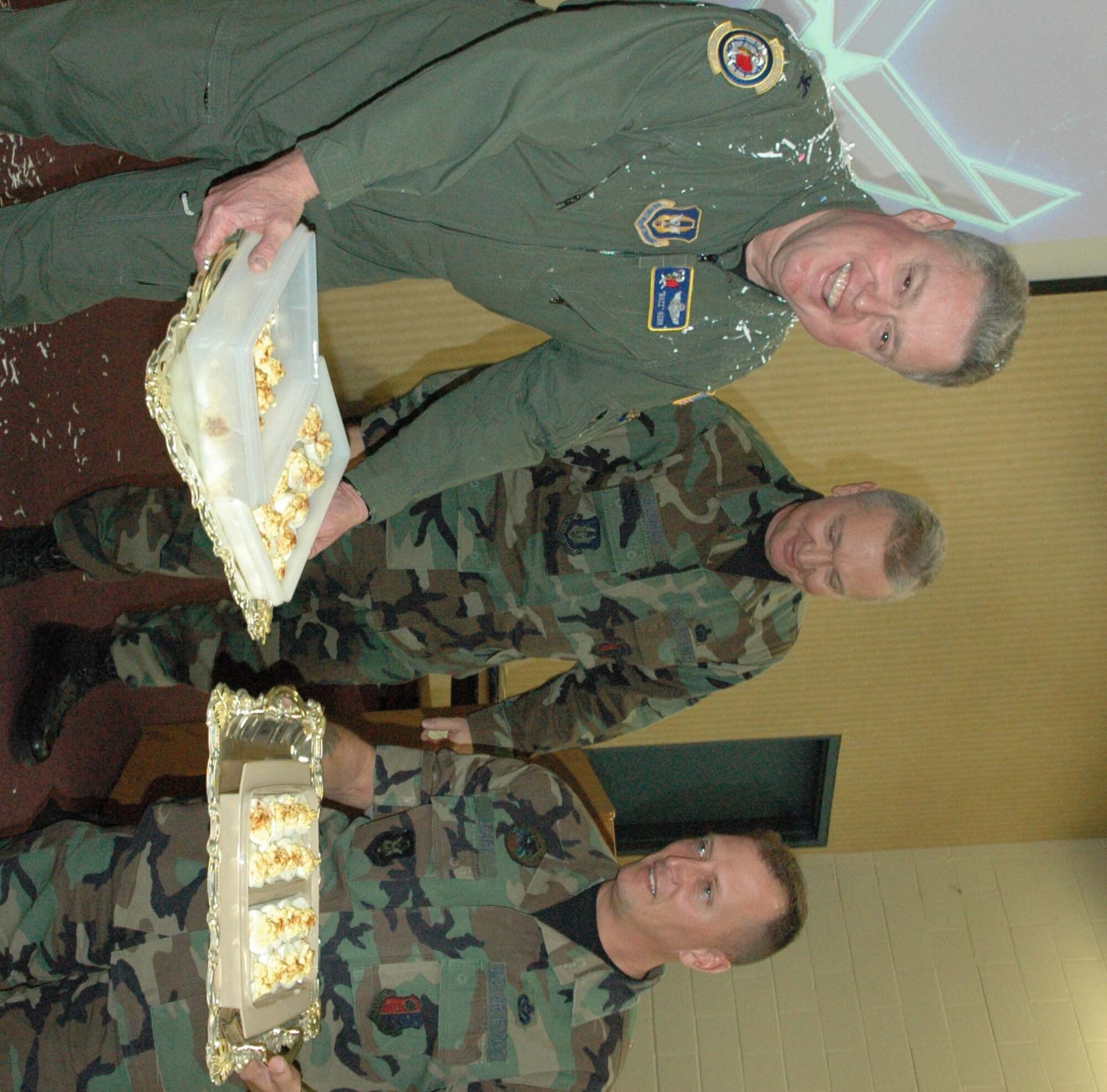 McGuire Air Force Base, NJ --  514th Air Mobility Wing Commander Col. James L. Kerr (left) shows off a presentation of eggs presented by the First Sergeants Council following positive results from the Air Force Reserve Command Unit Compliance Inspection held Nov 13-18.  One of Colonel Kerr's phrases leading up to the UCI had been, "I hear a lot of clucking, but don't see any eggs."  (U.S. Air Force photo/Master Sgt. Chuck Kramer)