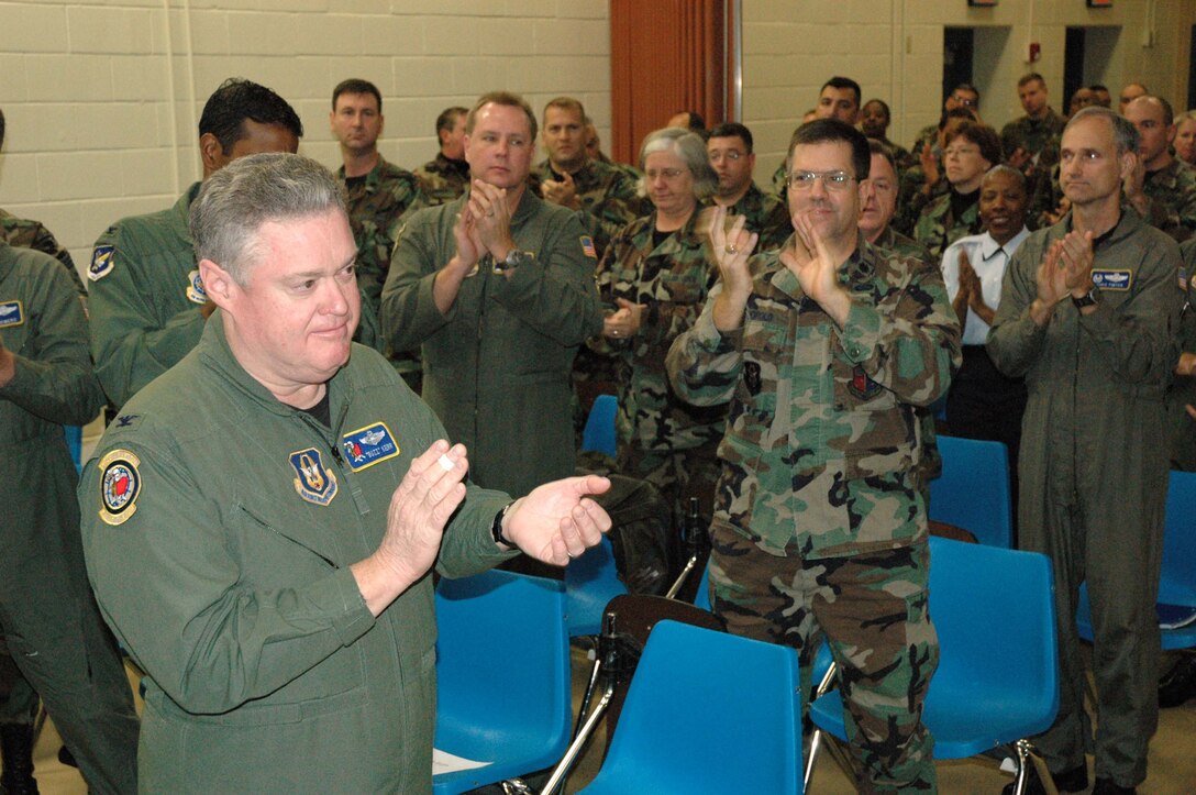 McGuire Air Force Base, NJ --  514th Air Mobility Wing Commander, Col. James L. Kerr, applauds wing members for their work in preparing for the Air Force Reserve Command Unit Compliance Inspection held Nov. 13-18. (U.S. Air Force photo/Master Sgt. Chuck Kramer)