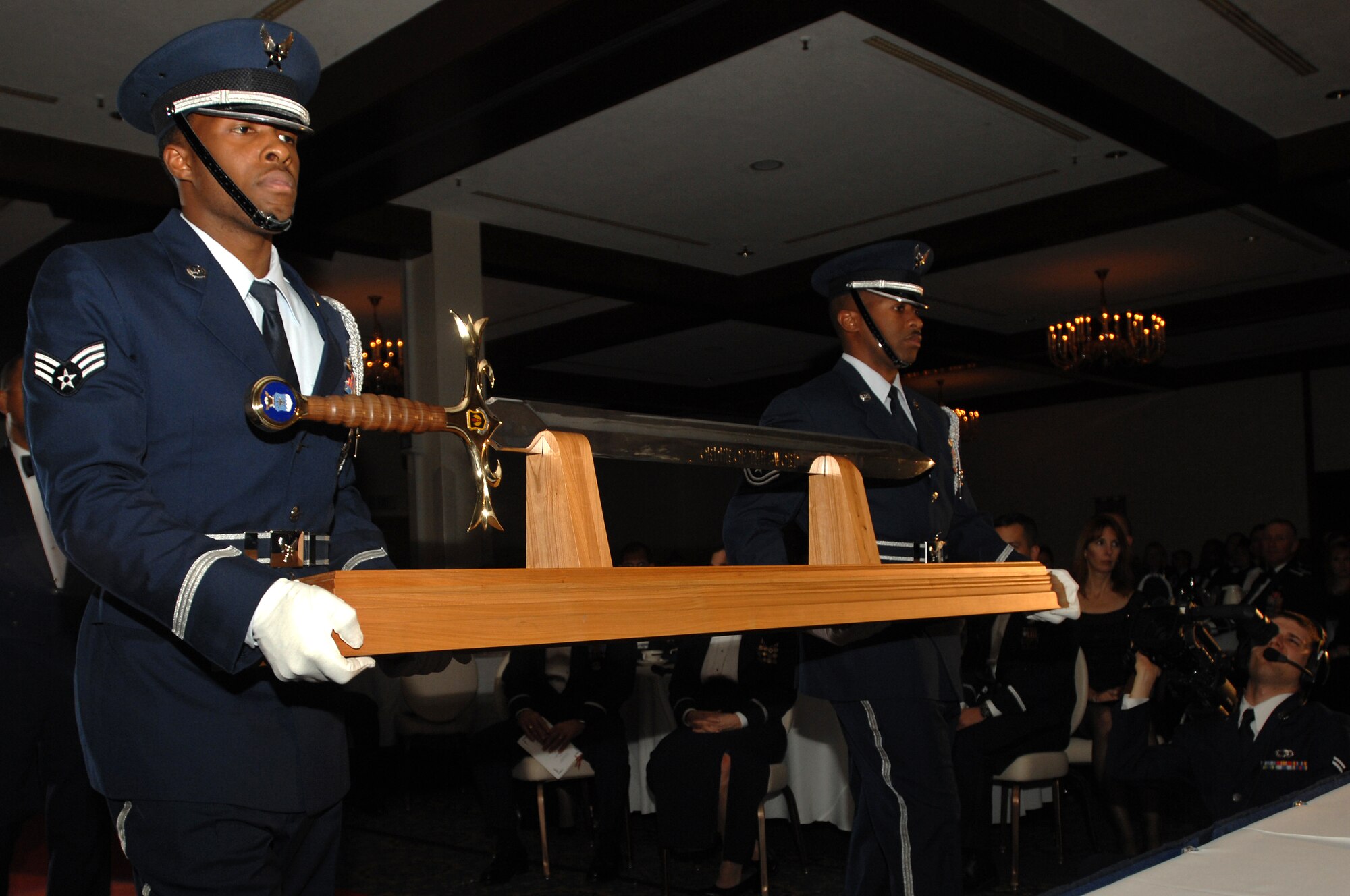 The United States Air Forces in Europe sword is bought up the isle to be placed in front of the head table during the Order of the Sword ceremony for Gen. William T. Hobbins Nov. 17 at Ramstein Air Base, Germany. (U.S. Air Force photo/Airman 1st Class Kenny Holston)