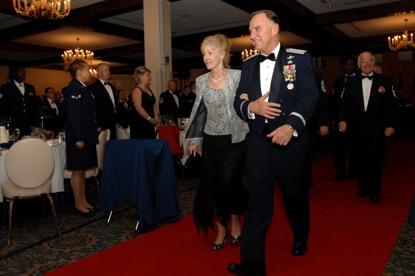 General William T. Hobbins, United States Air Forces in Europe commander, and his wife Robin make their way up the red carpet during the Order of the Sword ceremony Nov. 17 at Ramstein Air Base, Germany. General Hobbins received the Order of the Sword from Command Chief Master Sgt. Gary Coleman and command chiefs stationed in USAFE. (U.S. Air Force photo/Airman 1st Class Kenny Holston)