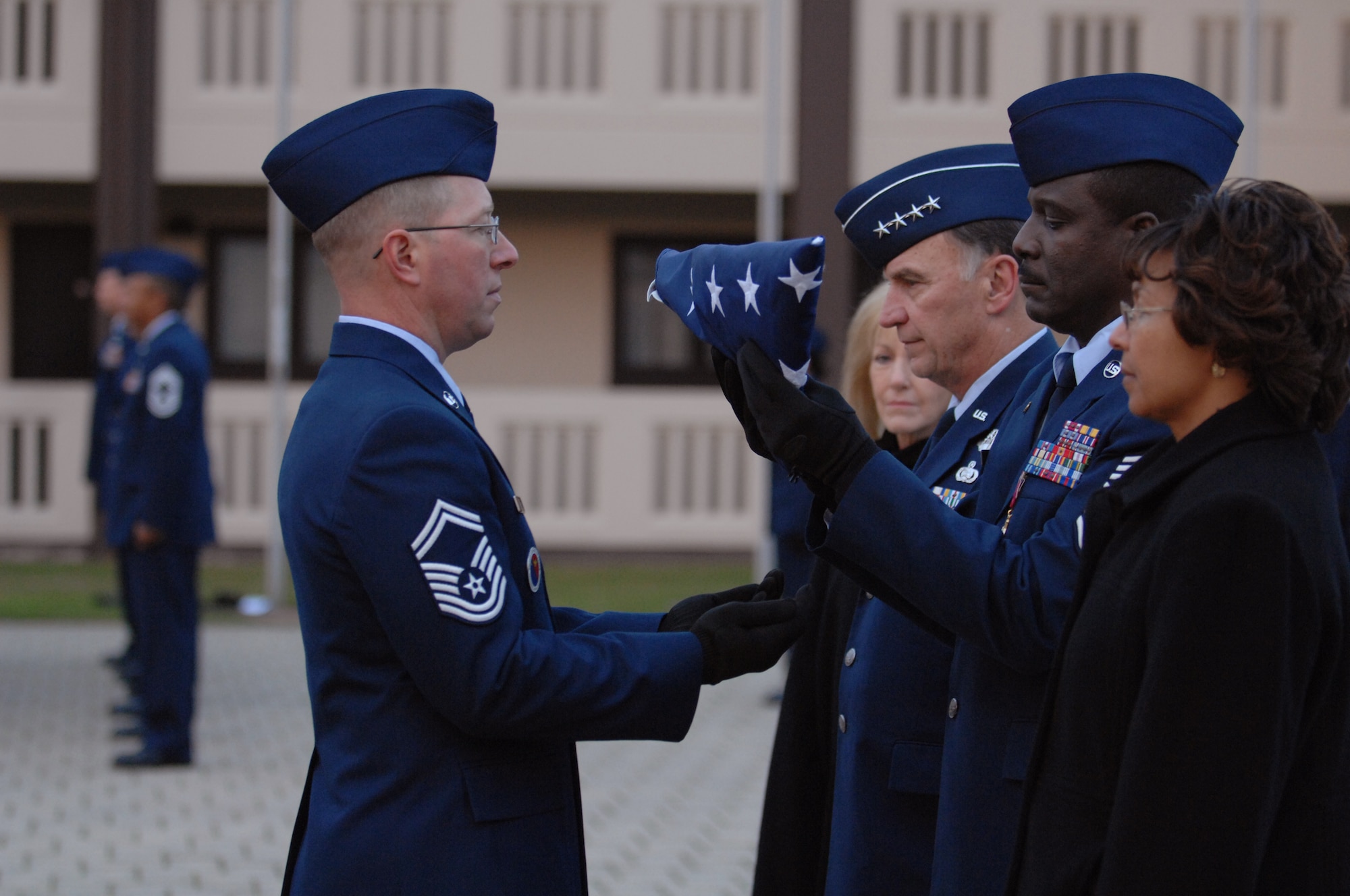 USAFE Command Chief Master Sergeant Gary G. Coleman returns the U.S Flag during a retreat ceremony at the Kisling Non-commisioned Officer Academy drill pad at Kapaun Air Station, Germany following a retirement ceremony in his honor for 30 years of military service.  The chief’s retirement is effective May 1, 2008. (U.S. Air Force photo by Tech Sgt. Corey Clements)