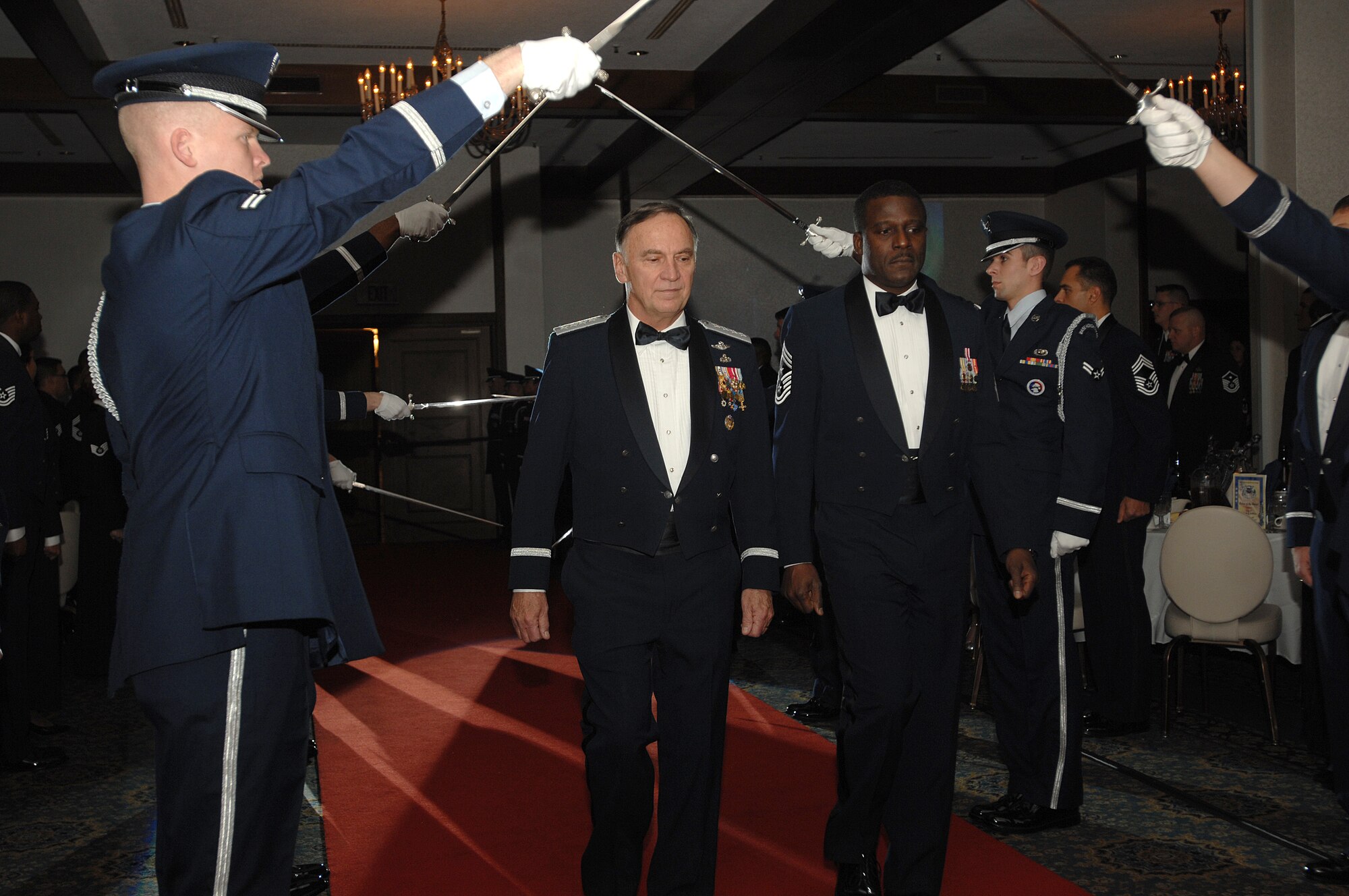 U.S. Air Forces in Europe Commander, General William T. Hobbins arrives for a USAFE order of the sword induction ceremony in his honor along with USAFE Command Chief Master Sergeant Gary G. Coleman, who’s also chief master sergeant of the mess for the ceremony.  The order of the sword induction is the highest honor the enlisted corps can bestow on an individual. (U.S. Air Force photo by Airman First Class Kenny Holston)