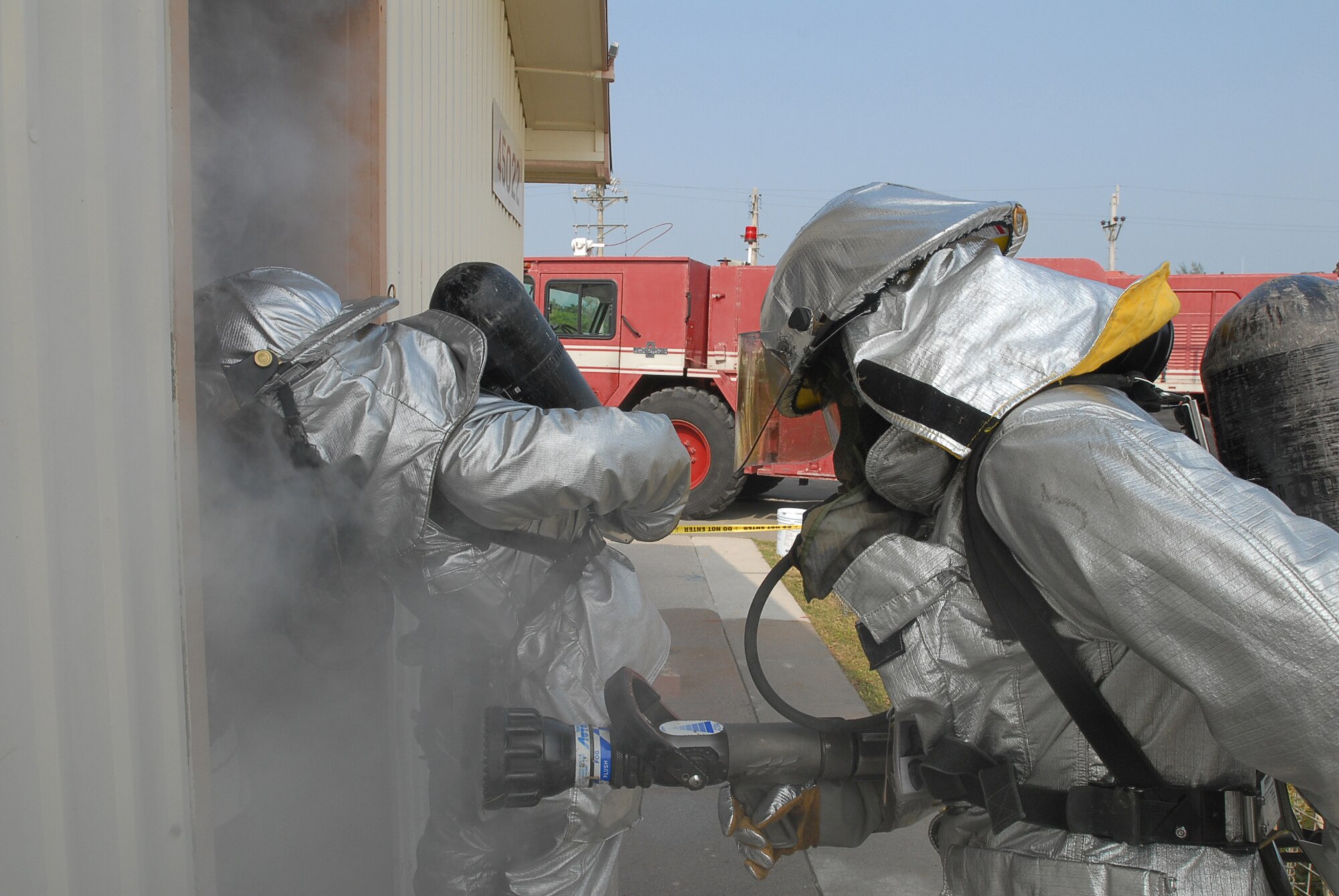 Firefighters from the 36th Civil Engineer Squadron prepare to enter a simulated building fire Nov. 16, 2007, at Kadena Air Base, Japan. Approximately 110 personnel, most from Andersen Air Force Base, Guam, attended the Det. 1, 554th Rapid Engineer Deployable Heavy Operational Repair Squadron Engineer Silver Flag exercise here. (U.S. Air Force photo/SrA Darnell T. Cannady)