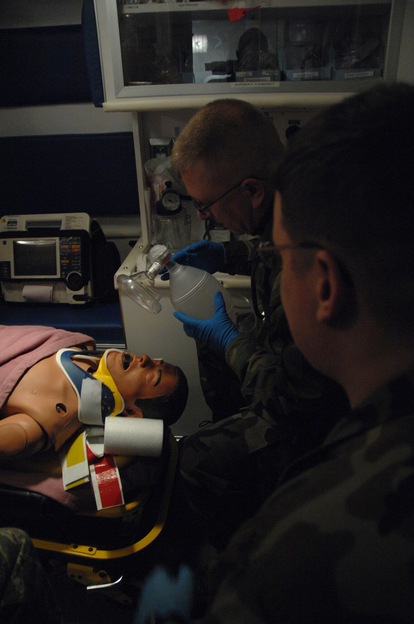 EIELSON AIR FORCE BASE, Alaska -- Maj. Gerald Mulhollen, 354th Security Forces Squadron commander, prepares to apply a resuscitator to a mannequin's mouth during a training exercise the 354th Medical Group had planned during the Leadership Symposium Nov. 16, 2007 at the medical clinic. The Leadership Symposium is held once a year offering insight to commanders, chiefs, and their spouses on the roles of different organizations of the 354th Fighter Wing and the purpose they serve. (U.S. Air Force photo by Airman 1st Class Christopher Griffin)