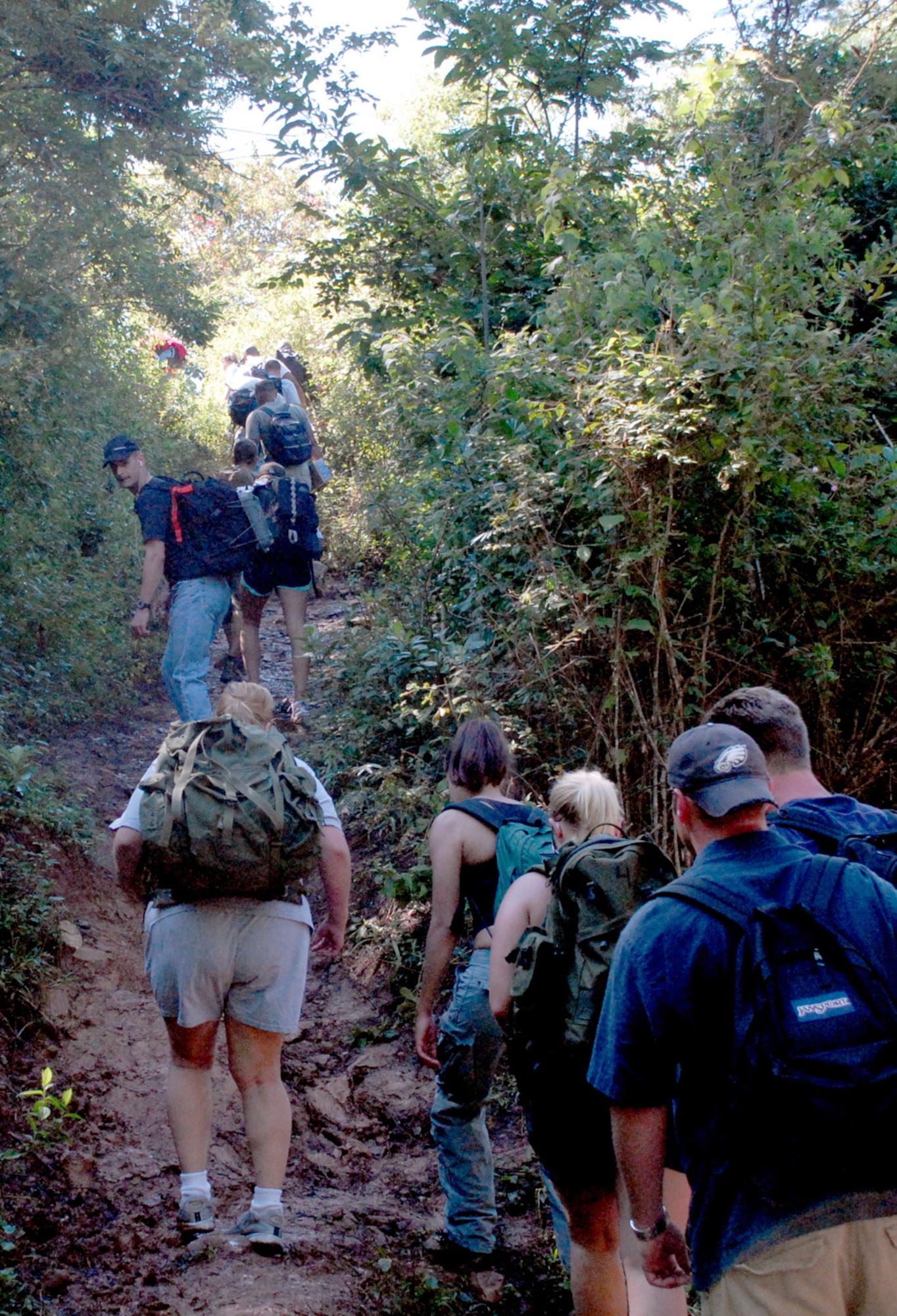 LA SAMPEDRANA, Honduras - Airman, Soldiers and Sailors from Joint Task Force-Bravo at Soto Cano Air Base, Honduras, traverse a steep trail to deliver food to a local village here. The servicemembers completed a five and a half mile hike up the mountain here to deliver more than 600 pounds of food to local villagers Nov. 17.  This hike is the third in a series of five sponsored by the JTF-Bravo Chapel. (U.S. Air Force photo/Tech. Sgt. Sonny Cohrs)