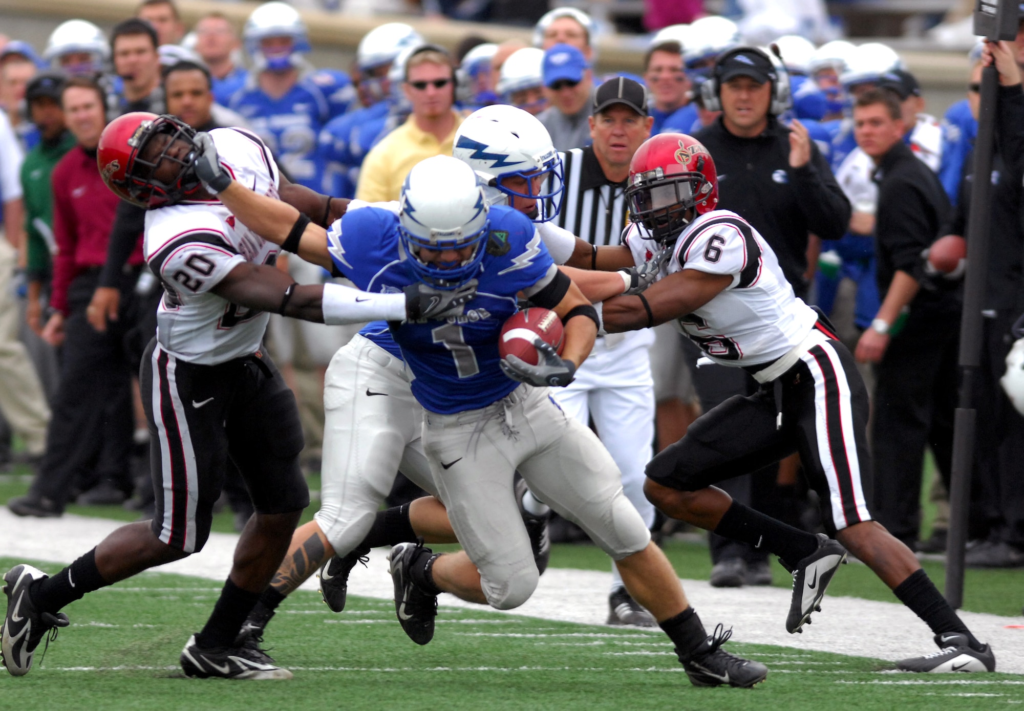Falcon z-back Chad Hall stiff arms San Diego State strong safety Ray Bass during Air Force's 55-23 win over the Aztecs Nov. 17 at Falcon Stadium. Hall gained 271 all-purpose yards, including 151 rushing and two touchdowns. (U. S. Air Force photo/Dave Armer) 