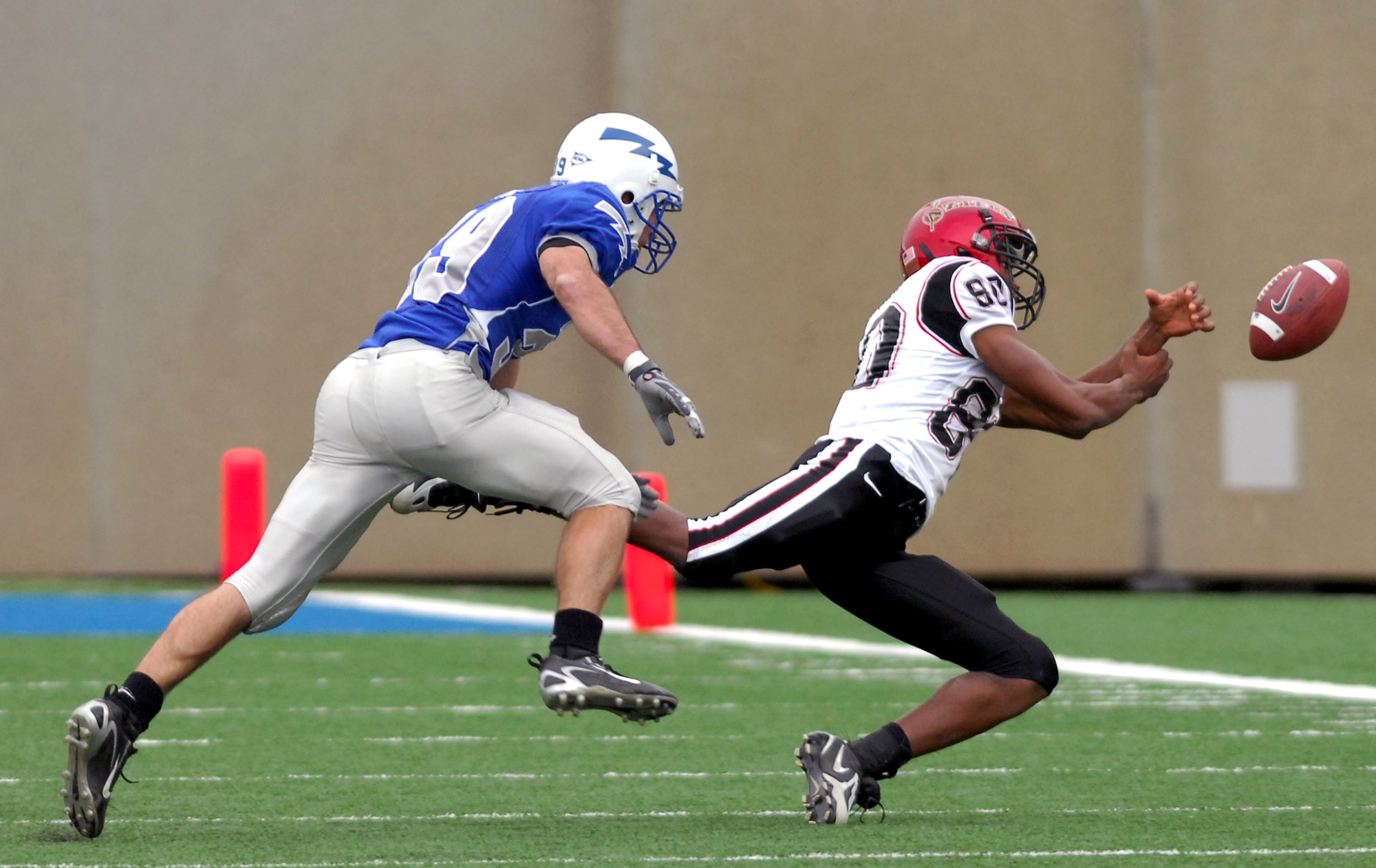 Falcon cornerback Garrett Rybak covers San Diego State wide receiver Vincent Brown during Air Force's 55-23 win over the Aztecs Nov. 17 at the Academy's Falcon Stadium. The bluesuiter defense limited Brown to 3 catches for 31 yards. (U.S. Air Force photo/Dave Armer) 