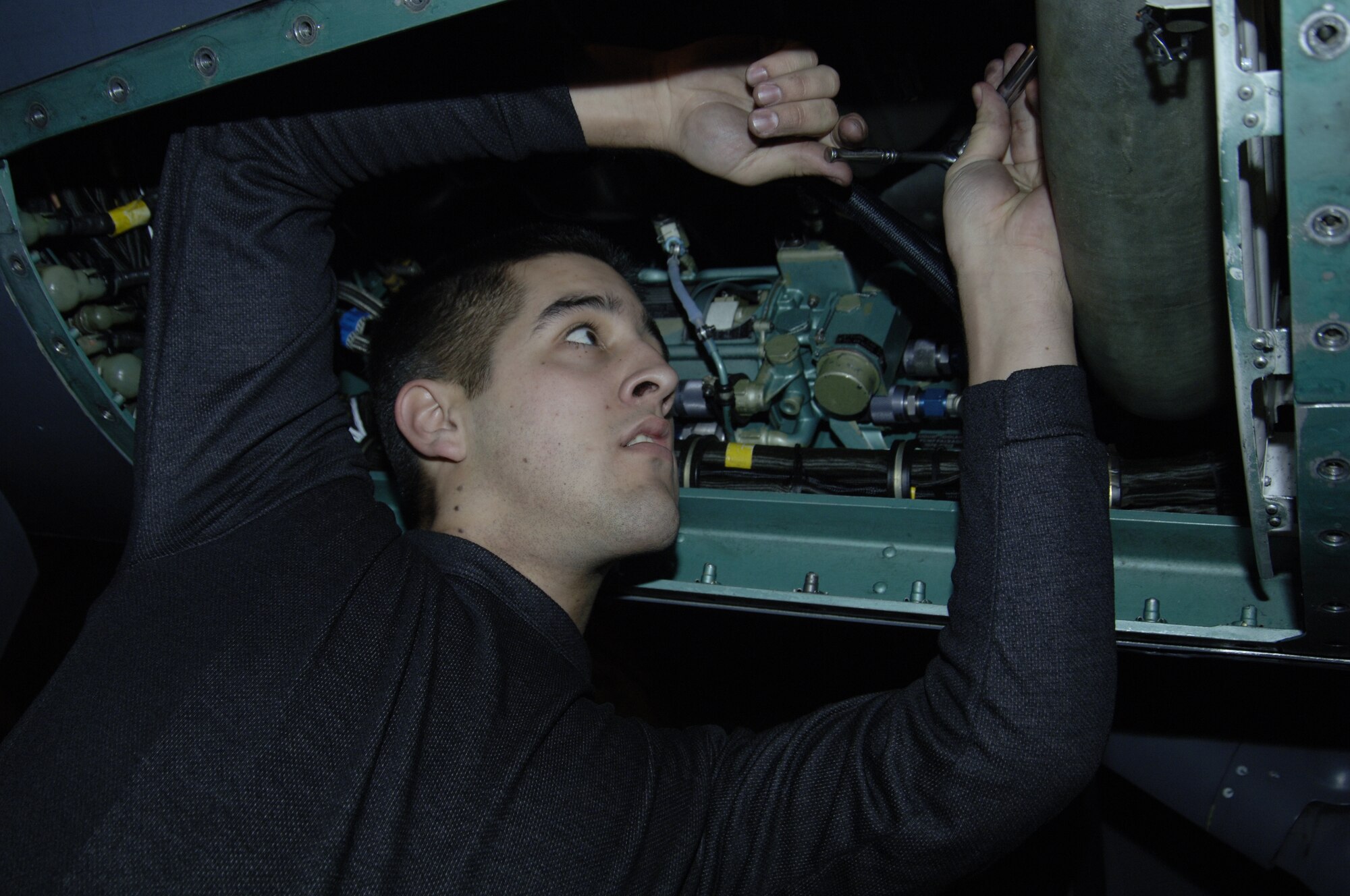 MOUNTAIN HOME AIR FORCE BASE, Idaho -- Senior Airman Jason Gonzalez, 391st Aircraft Maintenance Unit, installs an environmental control system duct after a full visual inspection of the structure of an F-15 here. Mountain Home’s F-15s are undergoing structural inspections in accordance with an order from Gen. John Corley, Air Combat Command Commander. (U.S. Air Force photo/ Staff Sgt. Rodney D. Ivey) 