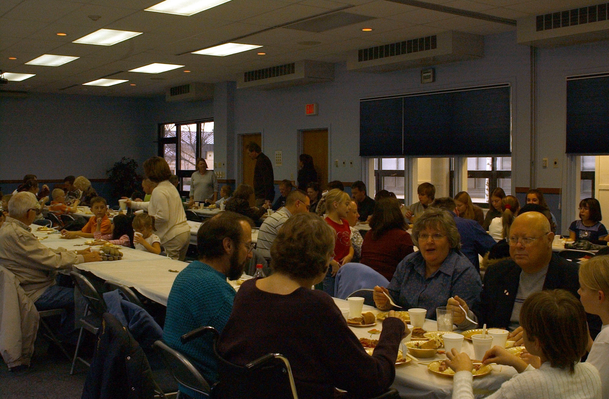 More than 100 members of the Catholic and Protestant communitys came together in the Chapel Annex Sunday to celebrate the annual community Thanksgiving dinner. The chapel provided the turkey, ham and gravy and community members brought the side dishes for all to enjoy. (U.S. Air Force photo/Valerie Mullett)
