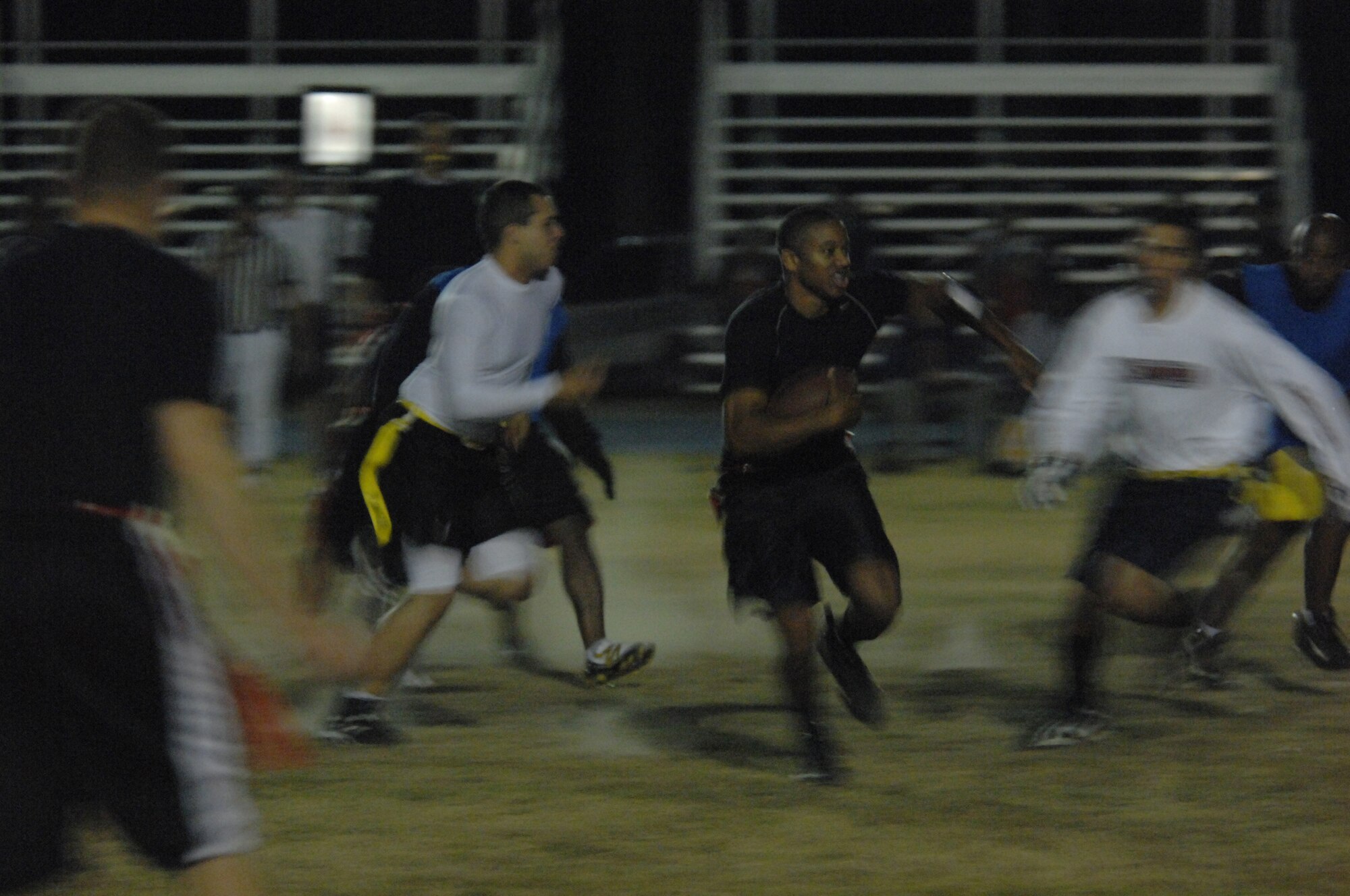 Members of the 23rd Services Squadron and 23rd Maintenance Squadron battle during the 2007 intramural football championship Nov. 14 here. Although both teams boasted a 7-2 record during regular season play, Services held the coveted number one seeding due to a victory against the 23rd MXS. (U.S. Air Force photo by Airman 1st Class Gina Chiaverotti)