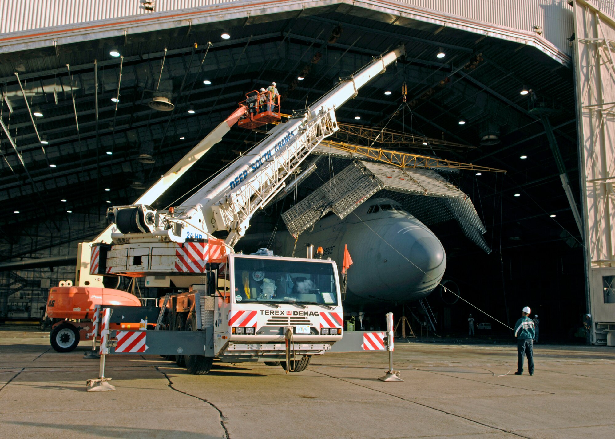 EGLIN AIR FORCE BASE, Fla. -- The C-5M Super Galaxy undergoes extreme heat and ultraviolet exposure during the Re-engining and Reliability Program at the McKinley Climactic Laboratory Oct. 21 through Nov. 17. Some of the unique challenges the laboratory crew faced was getting the C-5M inside the hangar. Another deviation from normal loading procedures was building the solar panels after the aircraft was loaded. This required special crews and crane systems to mount more than 90 solar panels to accurately simulate solar radiation during the extreme heat segment of the testing. (Photo by Wendell Rowan)
