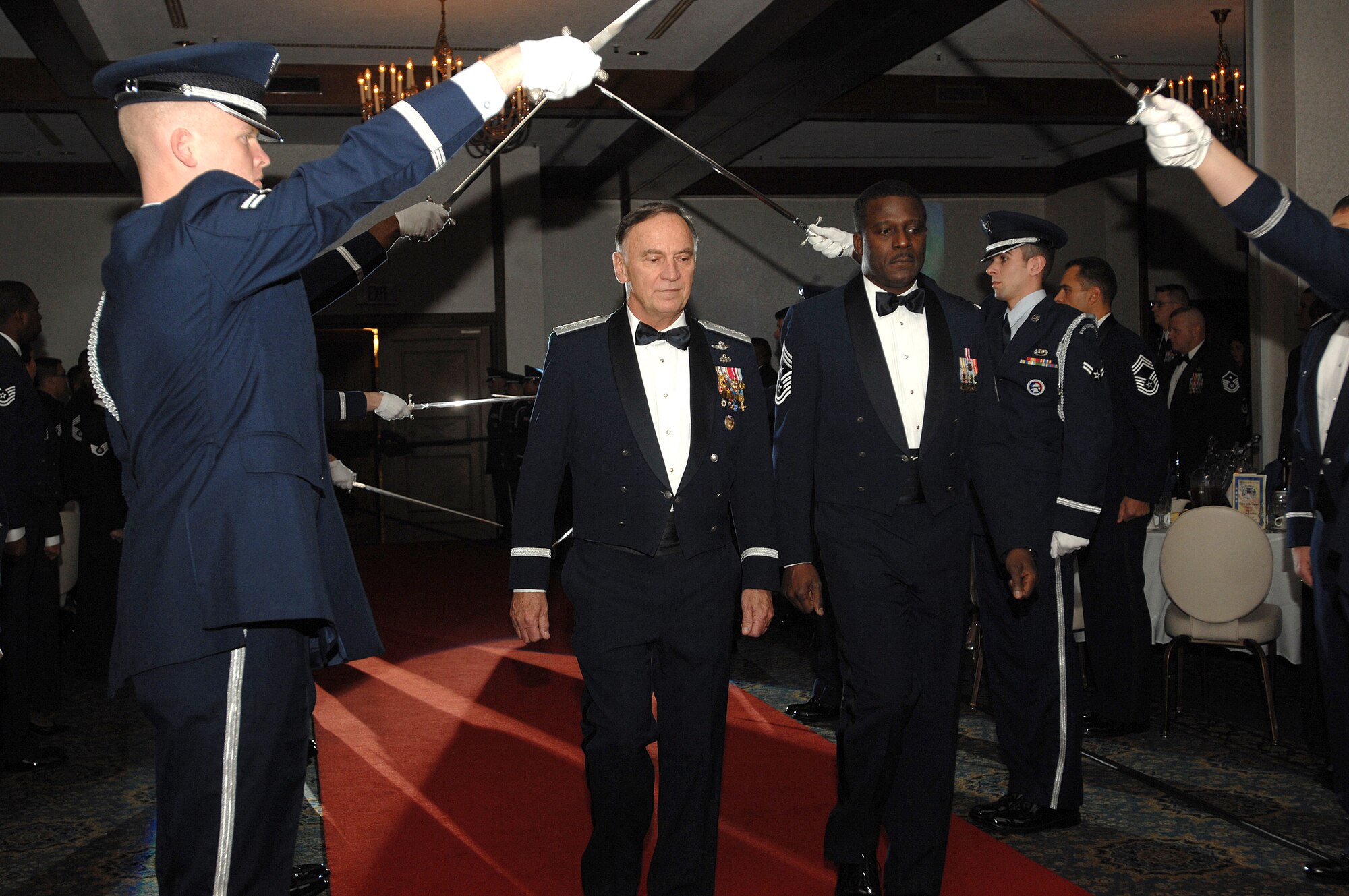 Gen. William T. Hobbins, U.S. Air Forces in Europe commander, arrives for a USAFE Order of the Sword induction ceremony in his honor along with USAFE Command Chief Master Sergeant Gary G. Coleman, who also was chief master sergeant of the mess for the ceremony. The Order of the Sword induction is the highest honor the enlisted corps can bestow on an individual. (U.S. Air Force photo/Airman First Class Kenny Holston)