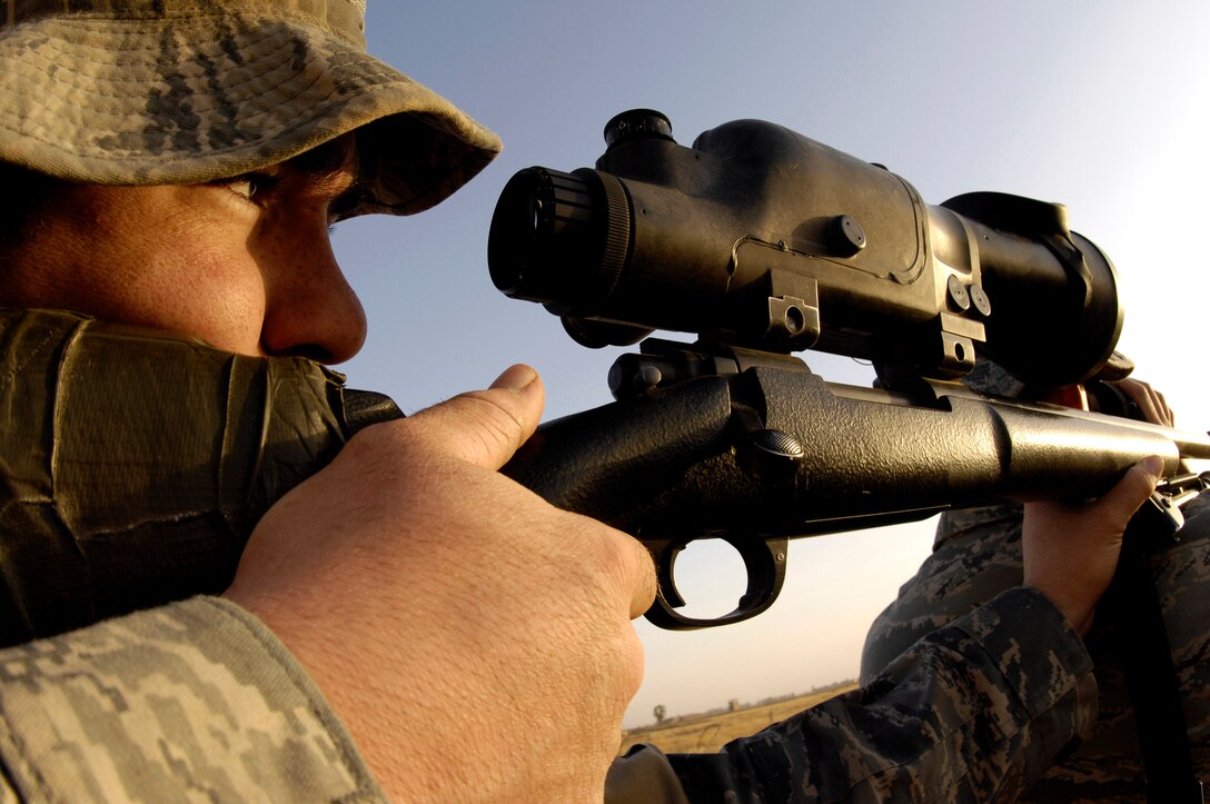 Airman 1st Class Matt Leeper slowly squeezes the trigger of his M-24 sniper rifle, the military version of a Remington 700 Nov. 14 near Kirkuk Regional Air Base, Iraq. Airman Leeper is a memeber of the 506th Expeditionary Security Forces Squadron Close Precision Engagement team. The CPET train as anti-sniper teams to target terrorist and insurgent snipers attacking U.S. and coalition forces in the area. Airman Leeper is deployed from the 354th Security Forces Squadron at Eielson Air Force Base, Alaska. (U.S. Air Force photo/Staff Sgt Angelique Perez) 