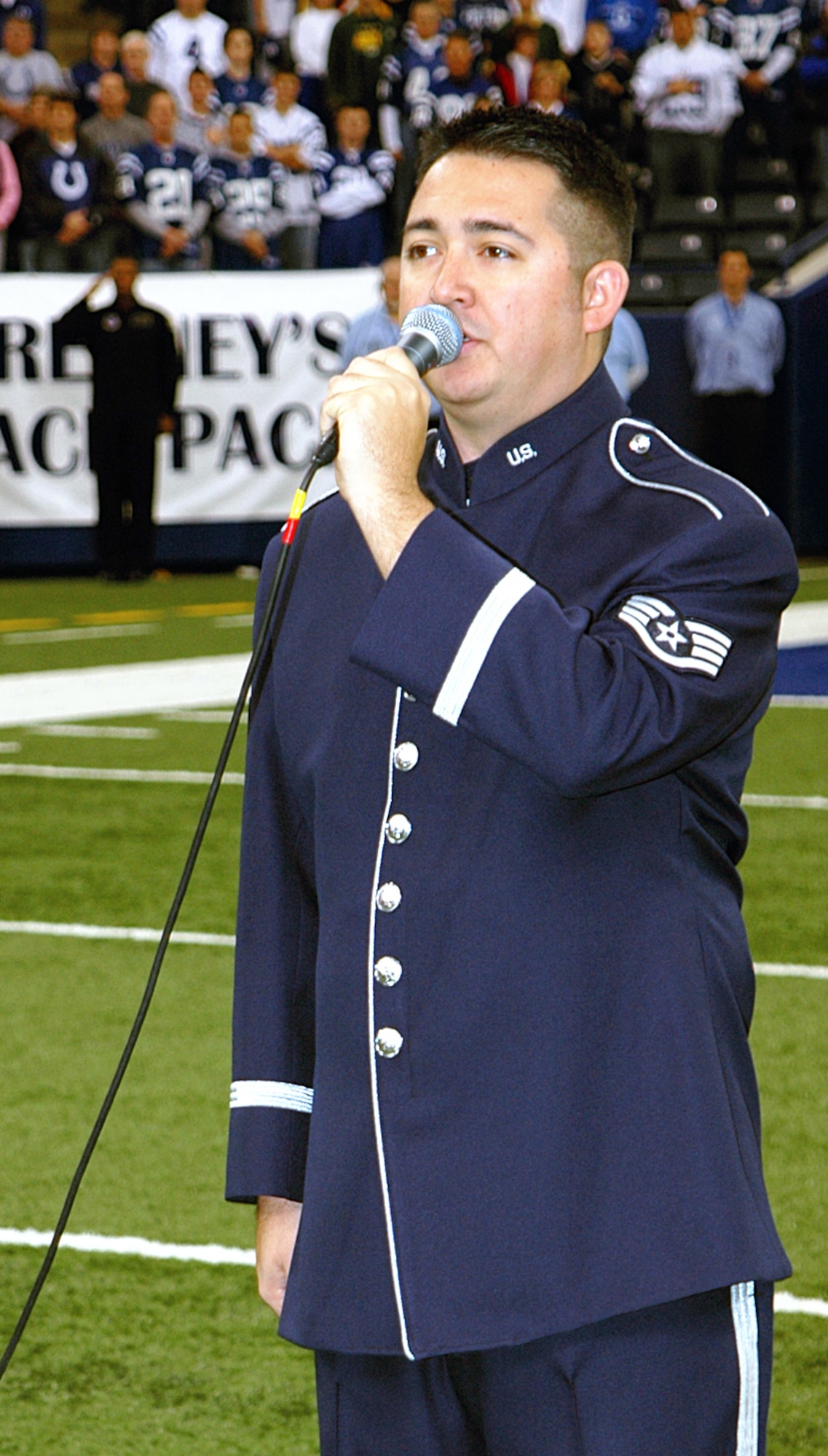 Staff Sgt. Justin Allen, Air Force Band of Flight, sang the national anthem to lead off the Colts vs. Chiefs NFL game, Nov. 18.  The Colts also received the prestigious American Spirit Award before to the start of the game. (U.S. Air Force photo/Senior Airman Carl Berry)