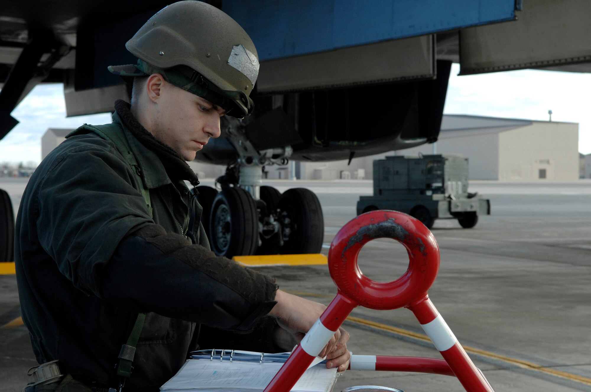 U.S. Air Force Airman 1st Class Edward Kovalcin, from the 28th Aircraft Maintenance Squadron, files maintenance paperwork for a B-1B Lancer after it was inspected during Operational Readiness Inspection (ORI) Coronet White 07-ACC-12 at Ellsworth Air Force Base, S.D., Nov. 17, 2007.  An Air Combat Command inspection team will use this ORI to evaluate Ellsworth's ability to effectively and rapidly deploy.  (U.S. Air Force photo/Staff Sgt. Michael B. Keller)