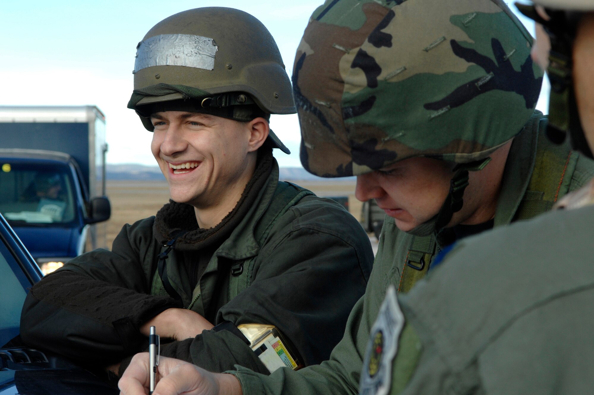U.S. Air Force Airman 1st Class Edward Kovalcin (left), from the 28th Aircraft Maintenance Squadron, presents Lt. Col. John Nichols, from the 37th Bomb Squadron, the maintenance paperwork for a B-1B Lancer prior to having it inspected during Operational Readiness Inspection (ORI) Coronet White 07-ACC-12 at Ellsworth Air Force Base, S.D., Nov. 17, 2007.  An Air Combat Command inspection team will use this ORI to evaluate Ellsworth's ability to effectively and rapidly deploy.  (U.S. Air Force photo/Staff Sgt. Michael B. Keller)