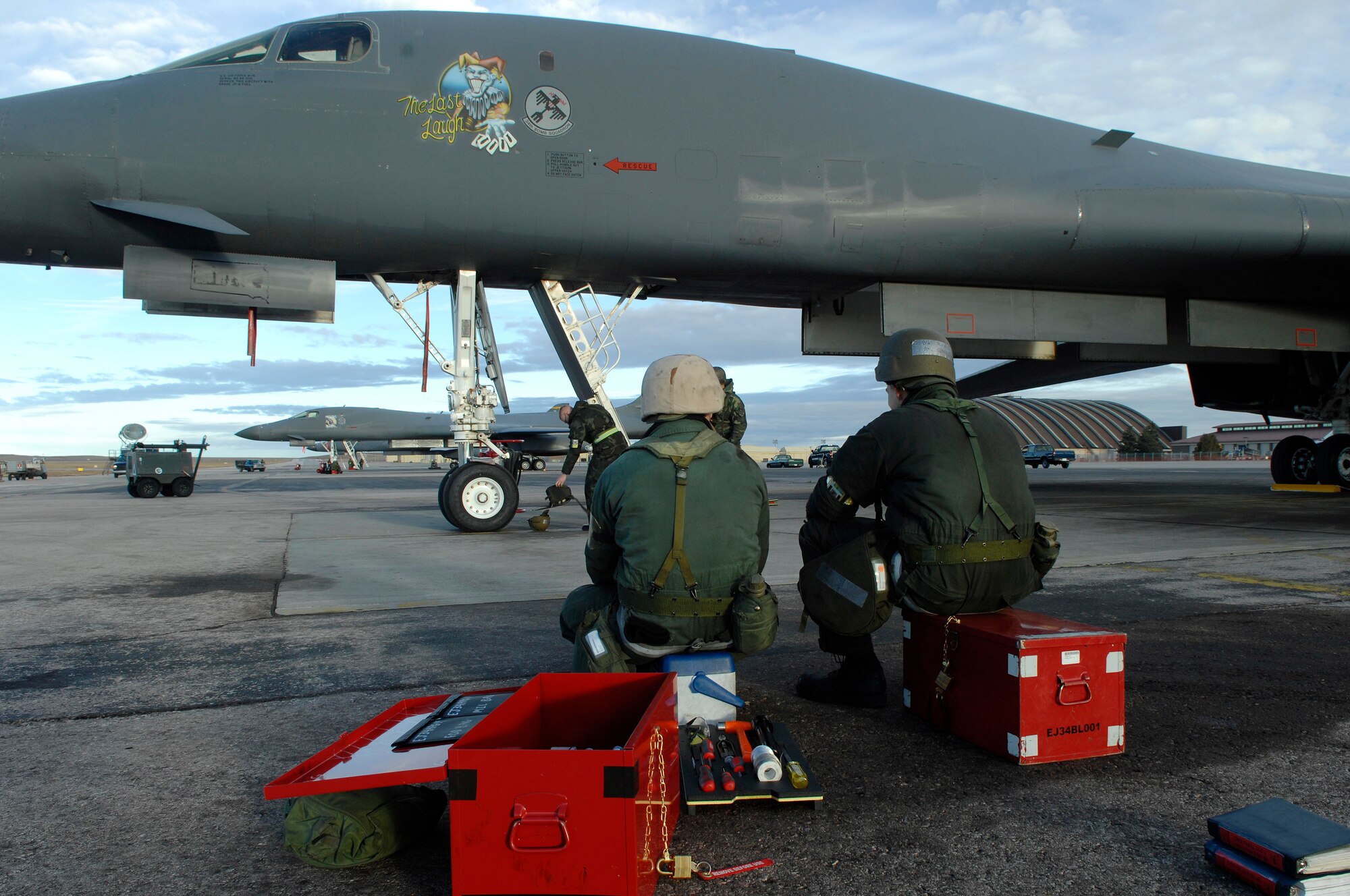 U.S. Air Force Senior Airman Courtney Armstrong (left), and Airman 1st Class Edward Kovalcin, both from the 28th Aircraft Maintenance Squadron, take a short break prior to having their B-1B Lancer inspected during Operational Readiness Inspection (ORI) Coronet White 07-ACC-12 at Ellsworth Air Force Base, S.D., Nov. 17, 2007.  An Air Combat Command inspection team will use this ORI to evaluate Ellsworth's ability to effectively and rapidly deploy.  (U.S. Air Force photo/Staff Sgt. Michael B. Keller)