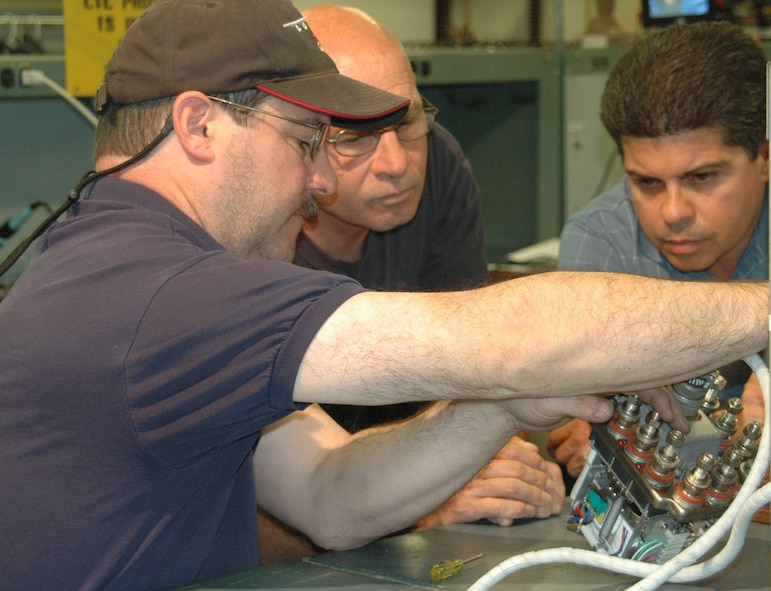 Tech. Sgt. Byron Labreche, 439th Maintenance Squadron, explains his electrical knowledge to visiting command officials in October. (US Air Force photo/Senior Master Sgt. Sandi Michon)   