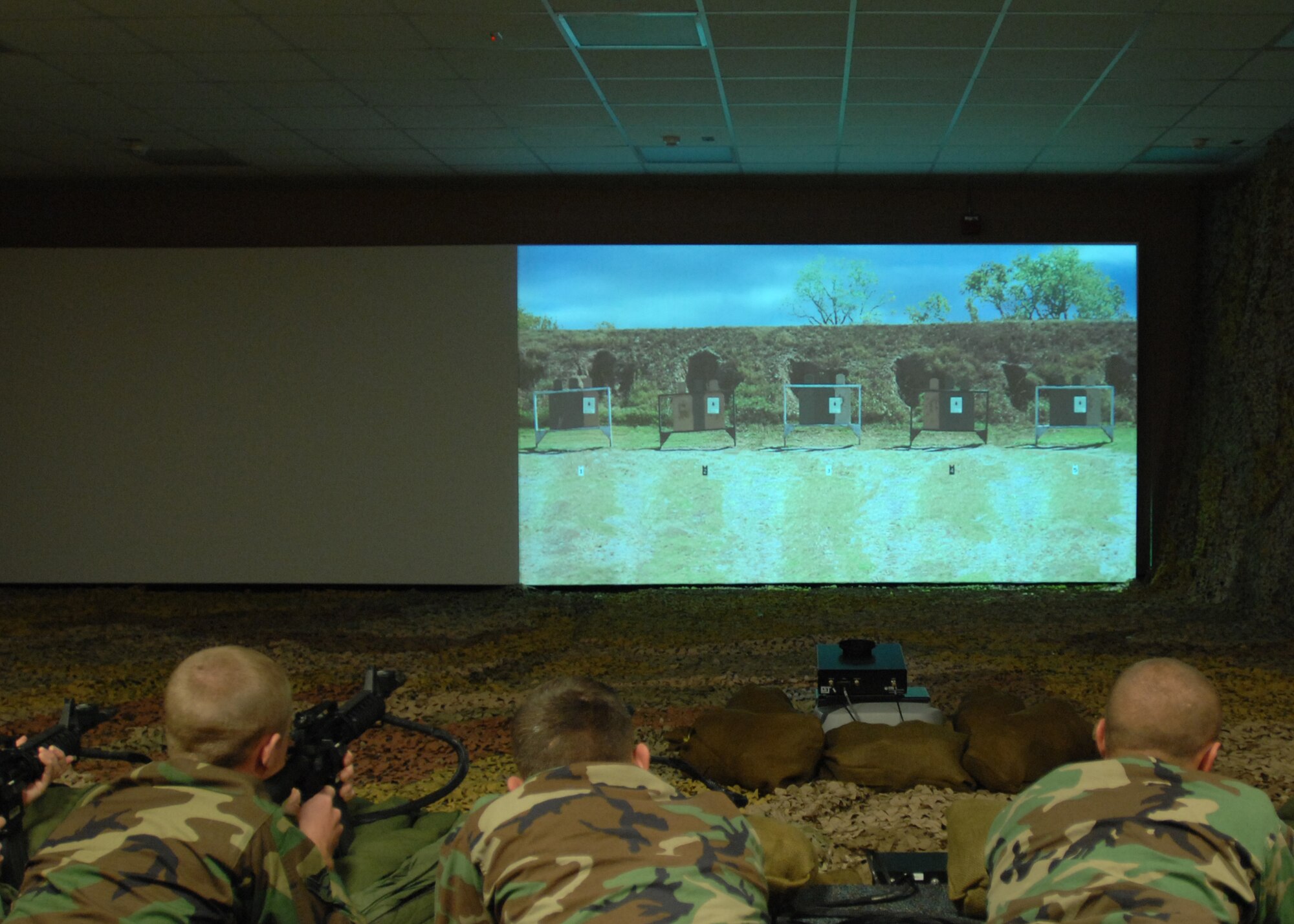Airmen of the 39th Security Forces Squadron train on the new Engagement Skills Tracker 2000, an indoor simulated firing range, on Nov. 15 at Incirlik Air Base, Turkey. The program is said to represent the wave of the future when it comes to firing technology. (U.S. Air Force photo by Airman 1st Class Timothy Taylor)