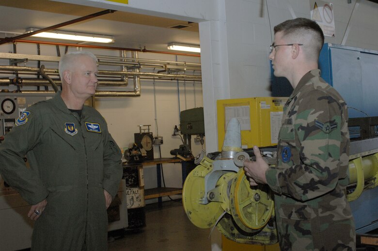 Airman 1st Class Ross Drown, 100th Maintenance Squadron (right), explains how the hydraulics flight helps keep RAF Mildenhall's fleet of KC-135 mission capable to Lt. Gen. Rod Bishop, 3rd Air Force commander. The general toured units at RAF Mildenhall during a visit Nov. 7. (U.S. Air Force photo by Airman 1st Class Brad Smith) 