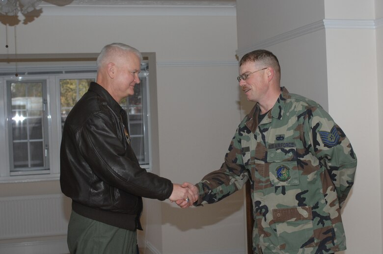 Lt. Gen. Rod Bishop, 3rd Air Force commander (left) greets Tech. Sgt. Bobby Wood, 100th Civil Engineer Squadron during the general's tour of RAF Mildenhall's base housing Nov. 7. (U.S. Air Force photo by Airman 1st Class Brad Smith) 